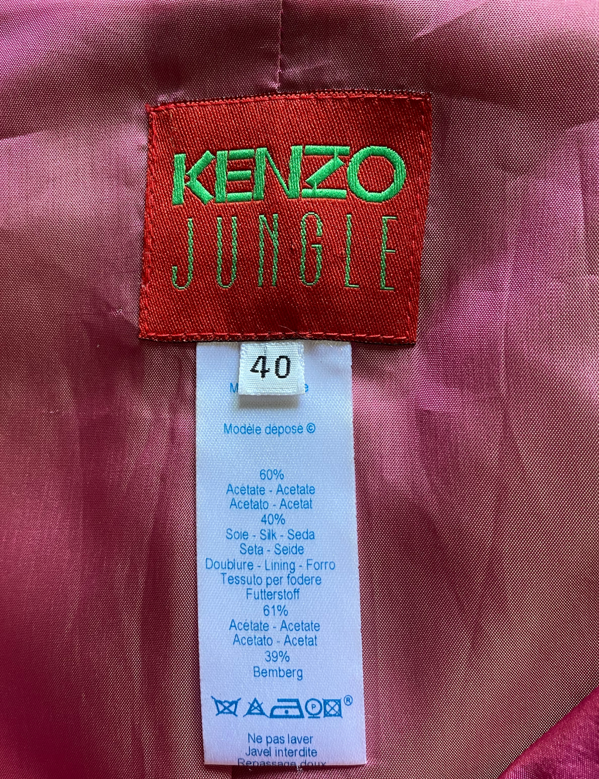 Kenzo Jungle Double Zip Front Shawl Collar Jacket  Brave the concrete jungle in style with the Kenzo Jungle Double Zip Front Shawl Collar Jacket. This magenta beau`