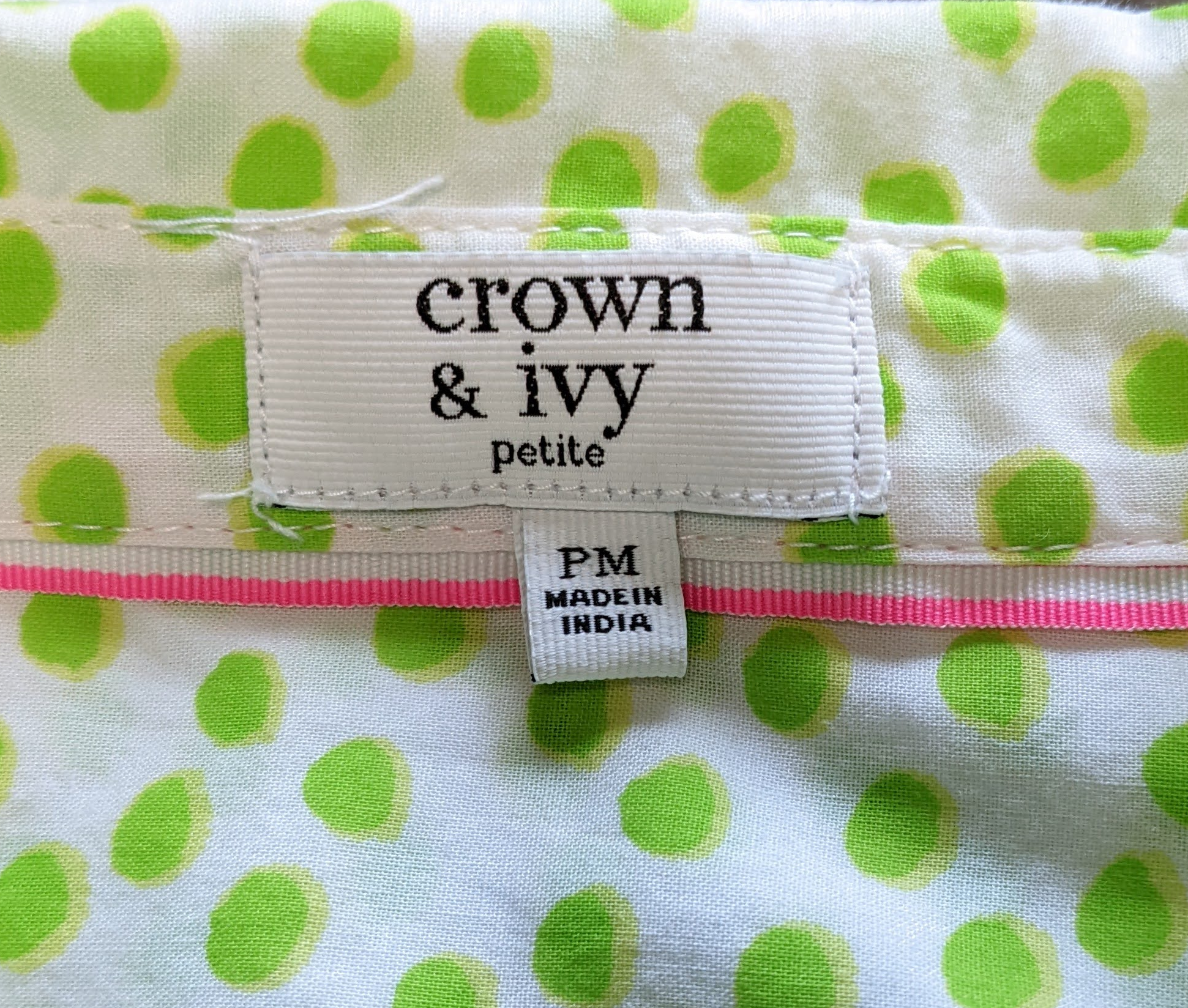 Crown & Ivy White Blouse with Green Polka DotsLight-weight and breezy, this is such a cute blouse.  It even has a touch of pink trim at the neck and cuffs, just because!