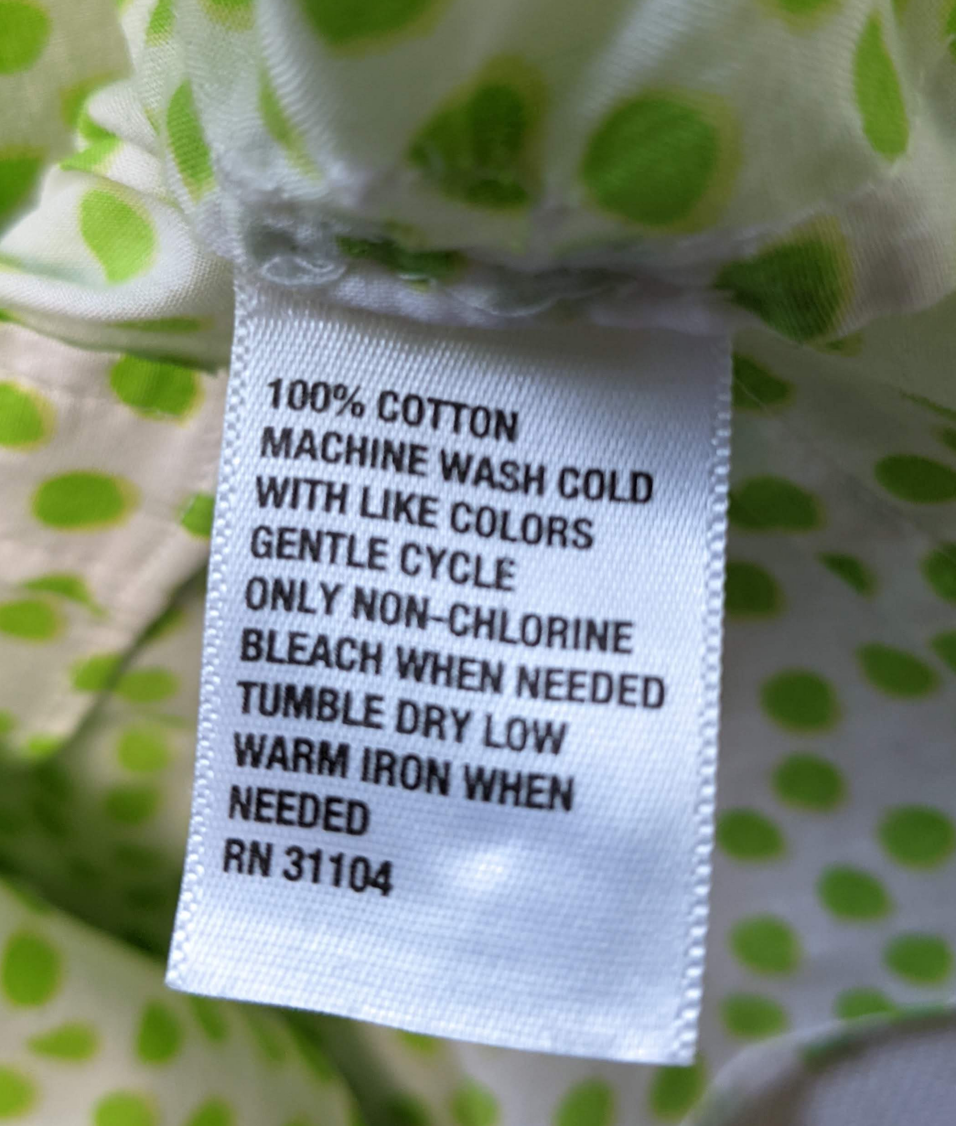 Crown & Ivy White Blouse with Green Polka DotsLight-weight and breezy, this is such a cute blouse.  It even has a touch of pink trim at the neck and cuffs, just because!