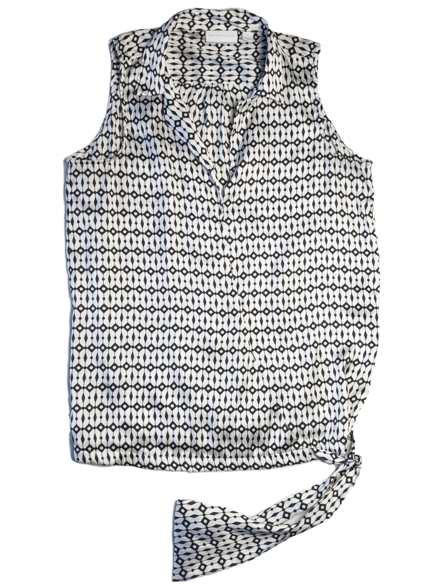 New York & Co Black and White Sleeveless Blouse This is a great top to dress down with jeans, or dress up with black slacks.  Or try a pop of color and wear with a g