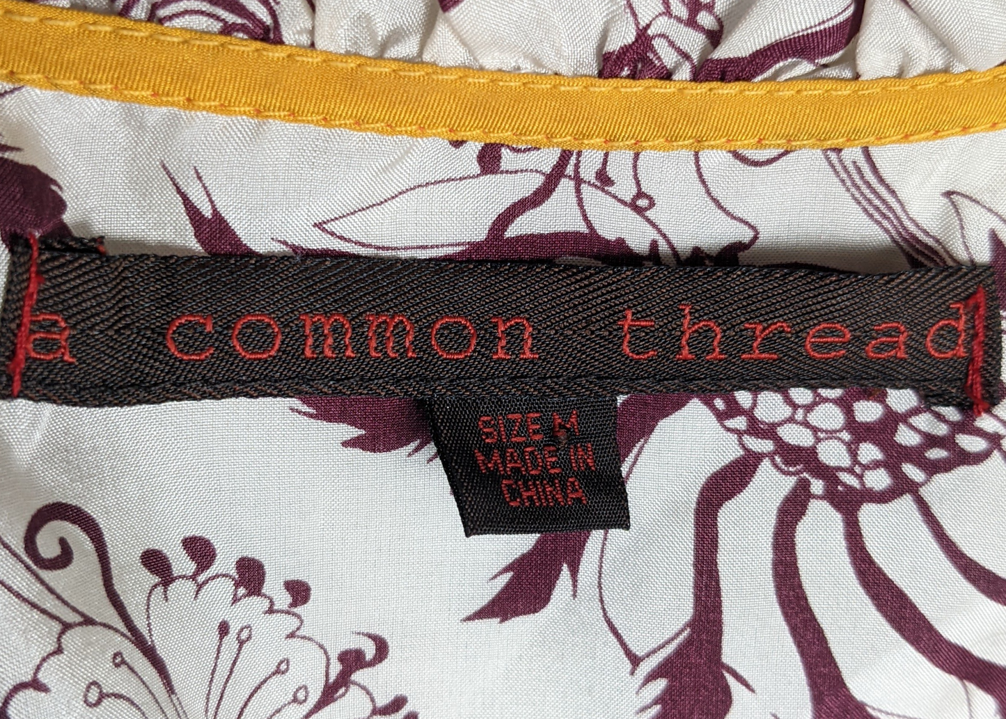Common Thread Silk  V-neck Ruffled-Edge Tank TopGreat tank to dress up!  The silk feels so luxurious and the style is just a little fancy!  Perfect for that special event!  Pair it with a black skirt or slacks andCommon Thread SilkWomens Tops