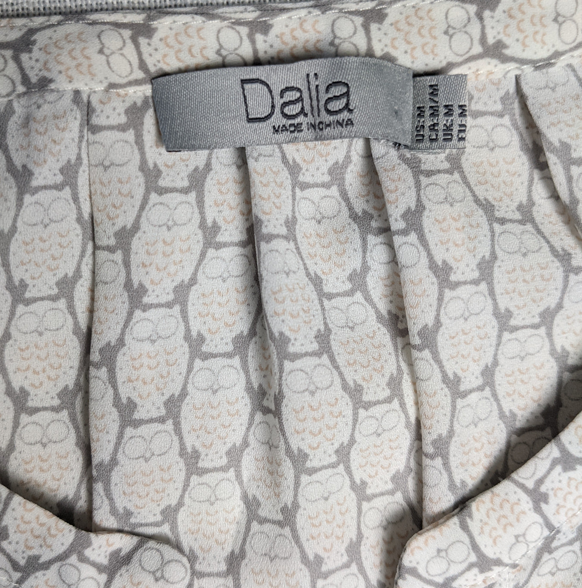 Dalia Owl Printed Tank TopIf you look real close, you can see the owls all over this shirt!  Perfect for anyone who loves owls.  It is not an overpowering design, but you will know they are t