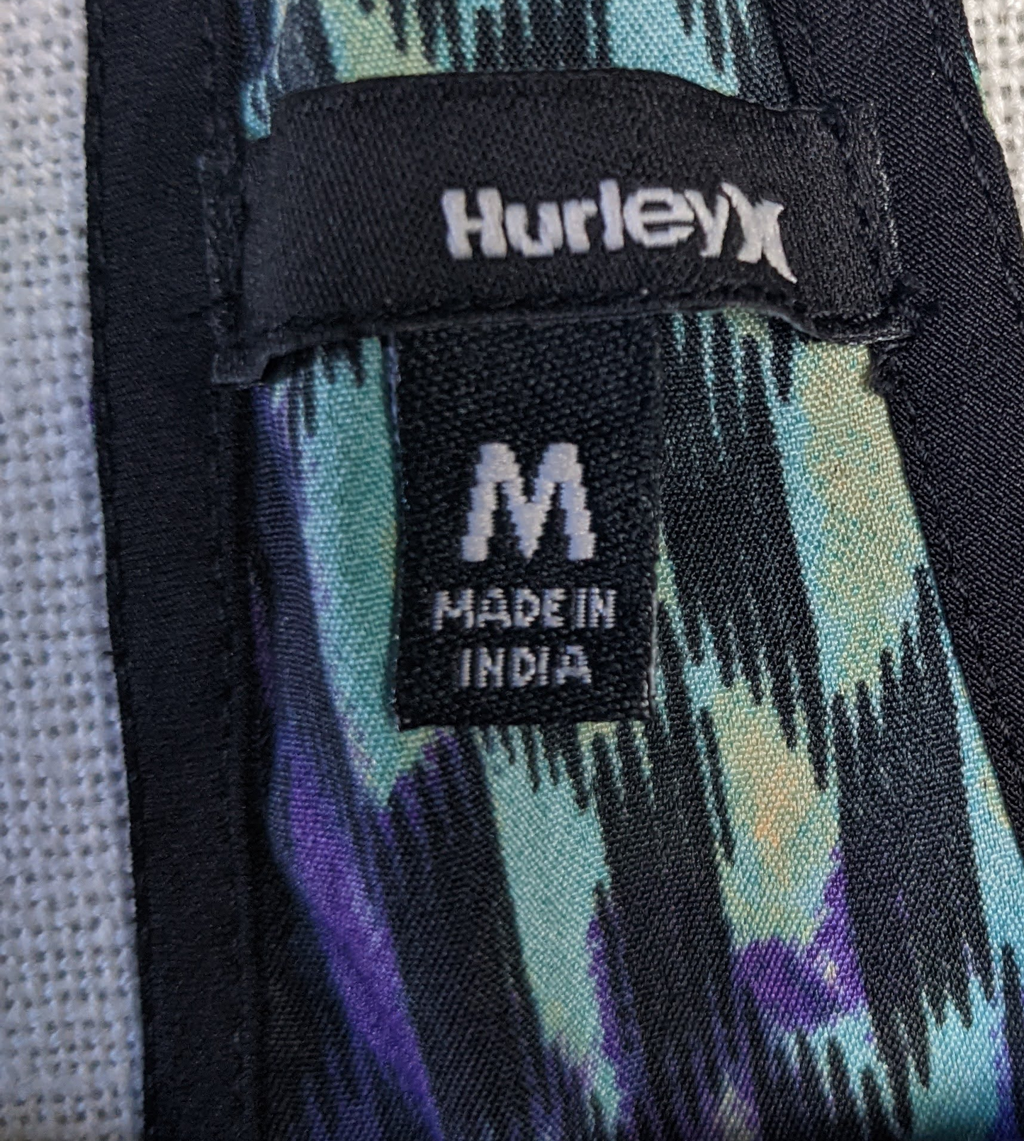 Hurley Racer Back Black Tank with Printed DetailsThis is a great tank for being on the beach, or at the gym.  The colors are great, and the styling is slimming!  You can't go wrong.