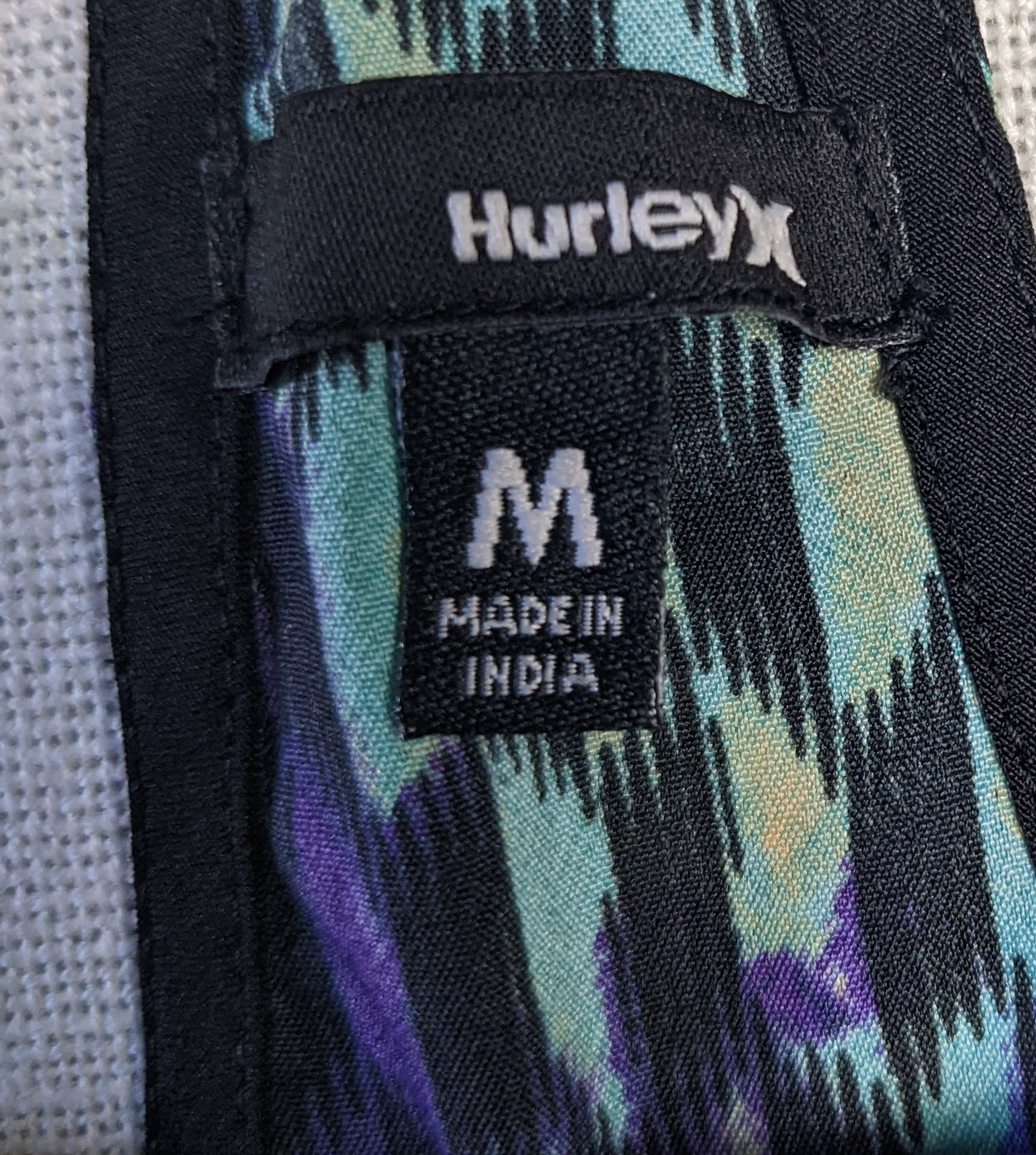 Hurley Racer Back Black Tank with Printed DetailsThis is a great tank for being on the beach, or at the gym.  The colors are great, and the styling is slimming!  You can't go wrong.