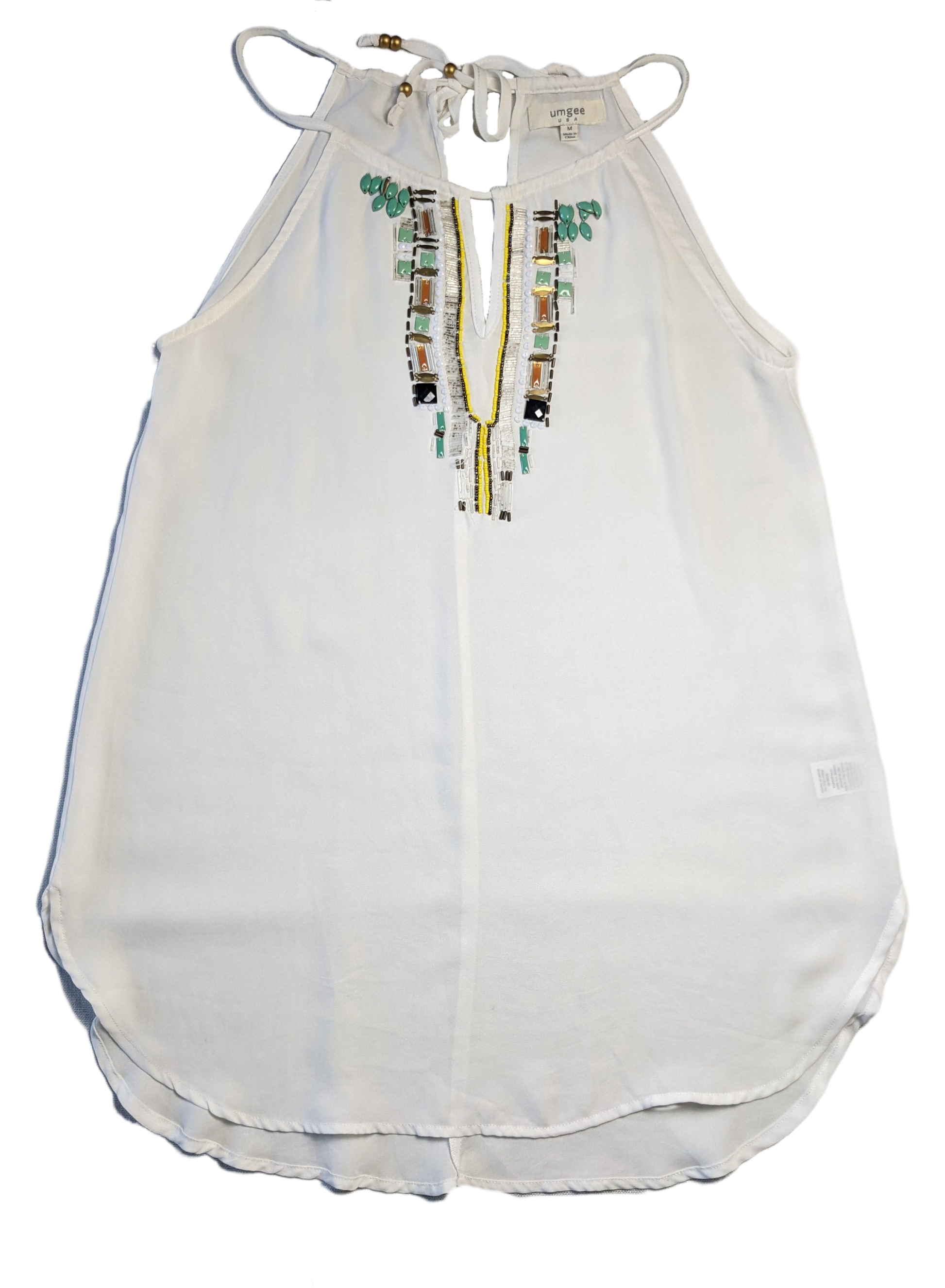 Umgee Halter Top with BeadingThis piece is so versatile, and it adds a little interest to your outfit, too!  You can wear this in warmer weather (or on a winter vacay!) with shorts and sandals,