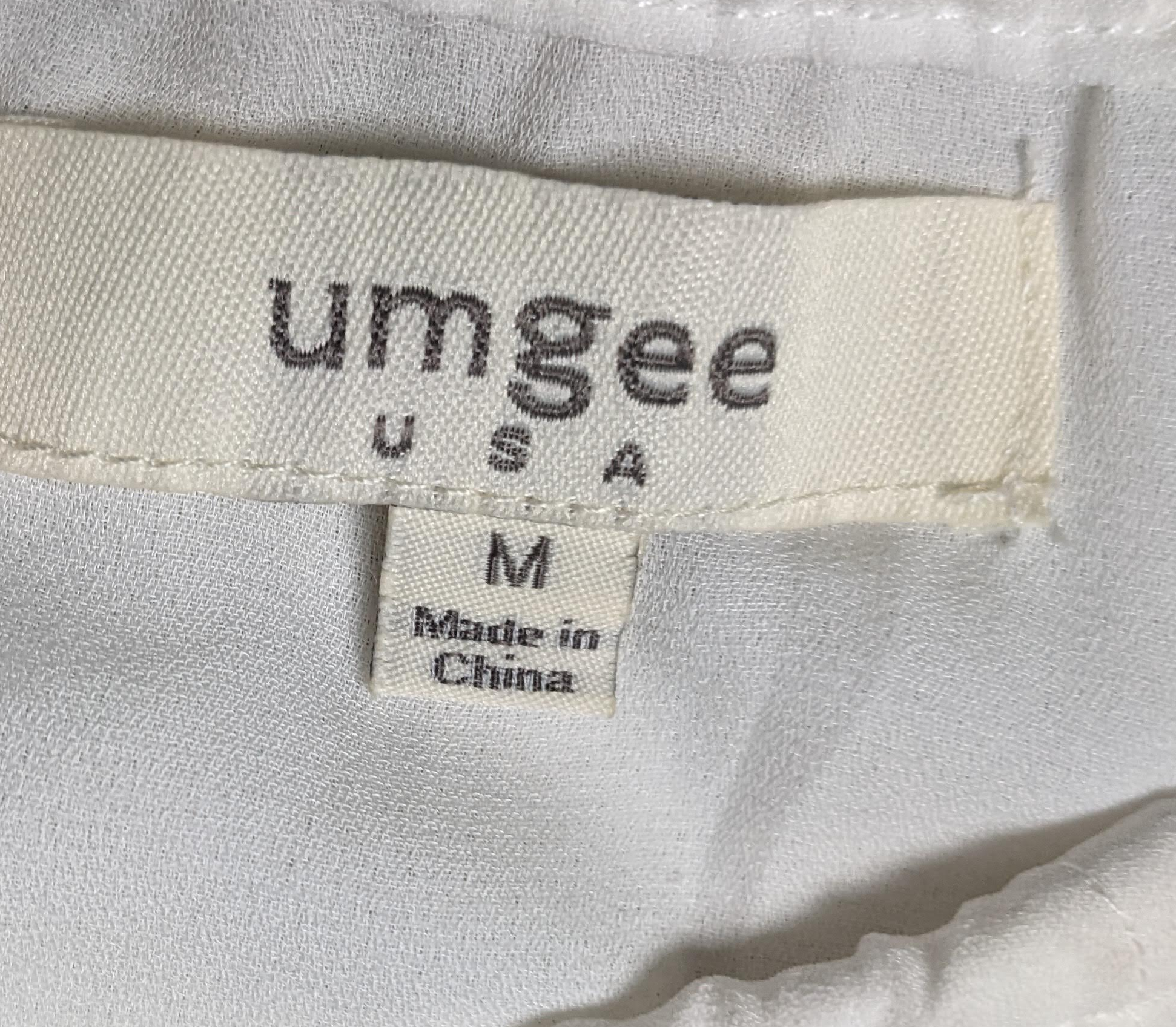 Umgee Halter Top with BeadingThis piece is so versatile, and it adds a little interest to your outfit, too!  You can wear this in warmer weather (or on a winter vacay!) with shorts and sandals,