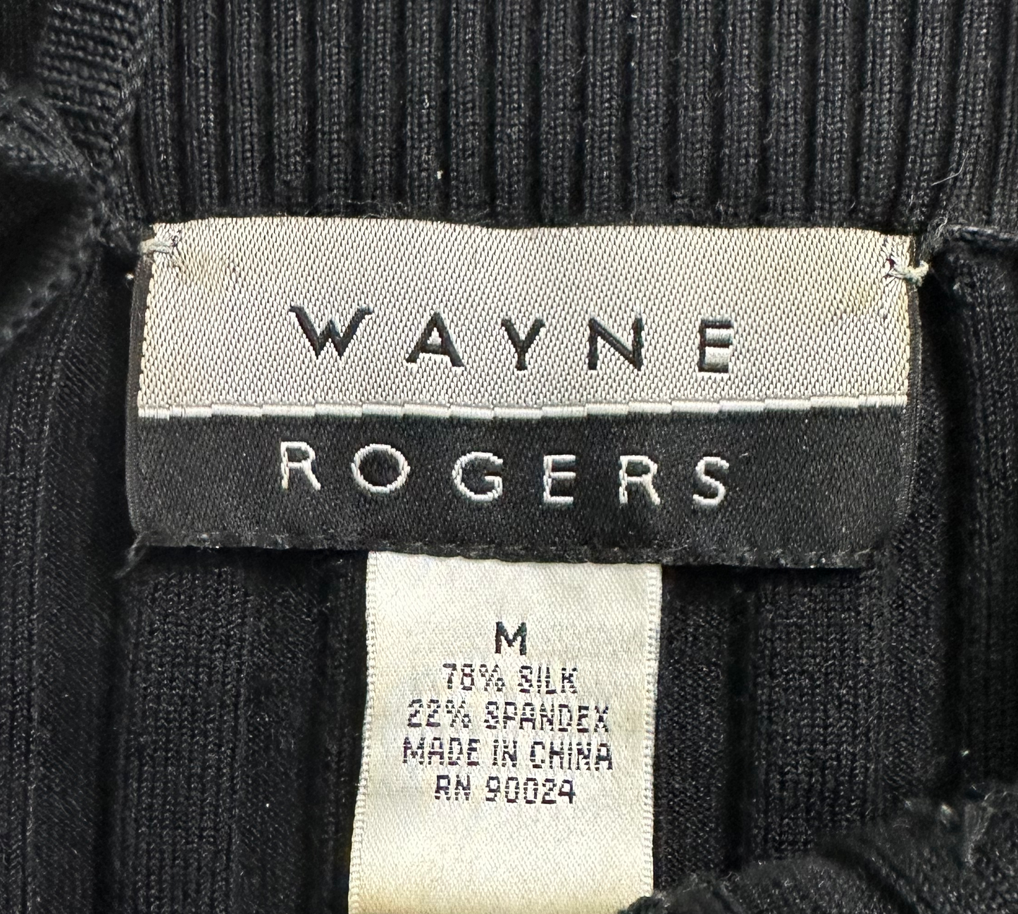 Wayne Rogers Black Silk Knit Beaded TankStay chic and cool with Wayne Rogers' black silk beaded tank, crafted from luxuriously lightweight silk knit, adorned with delicate beading, and completed with daintWayne Rogers Black Silk Knit Beaded TankTops
