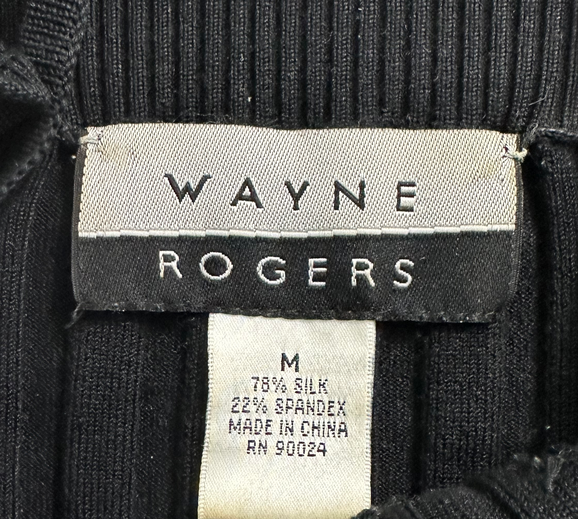 Wayne Rogers Black Silk Knit Beaded TankStay chic and cool with Wayne Rogers' black silk beaded tank, crafted from luxuriously lightweight silk knit, adorned with delicate beading, and completed with daintWayne Rogers Black Silk Knit Beaded TankTops