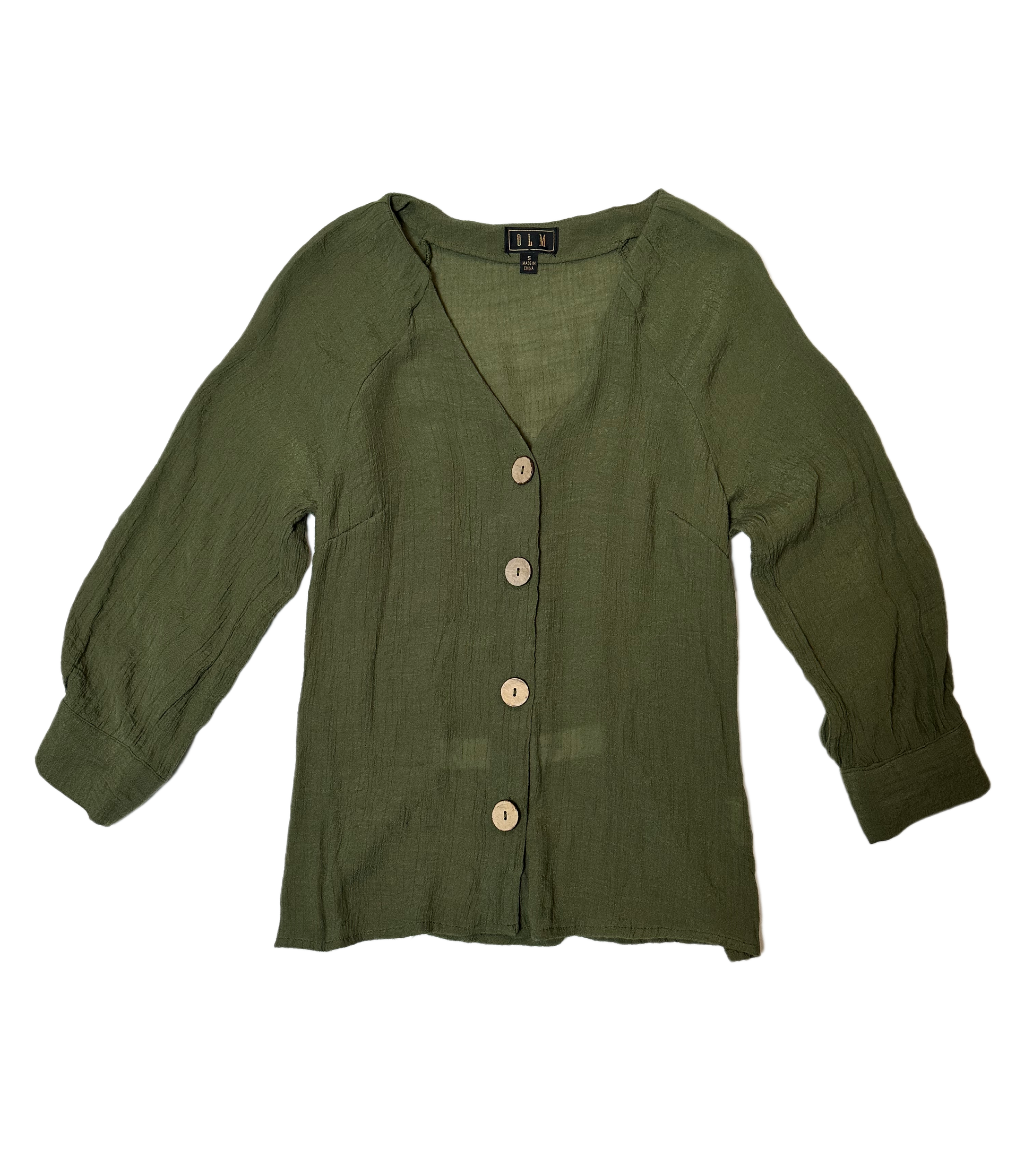 OLM Green Gauze Button Front BlouseWear this blouse to work, than change into chunky heels for a casual dinner out. The light weight fabric makes it perfect for those warmer nights.OLM Green Gauze Button Front BlouseShirt