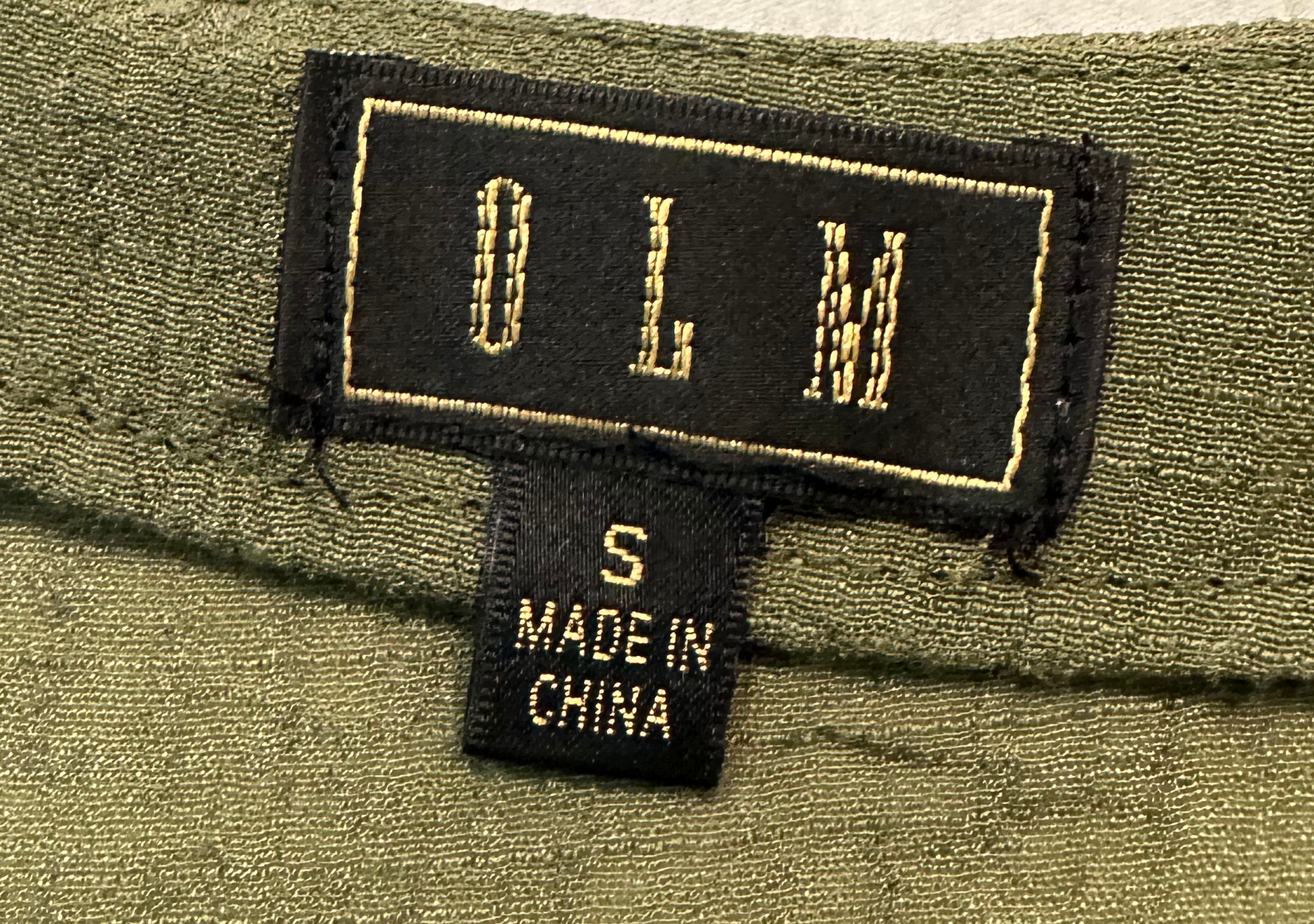 OLM Green Gauze Button Front BlouseWear this blouse to work, than change into chunky heels for a casual dinner out. The light weight fabric makes it perfect for those warmer nights.OLM Green Gauze Button Front BlouseShirt
