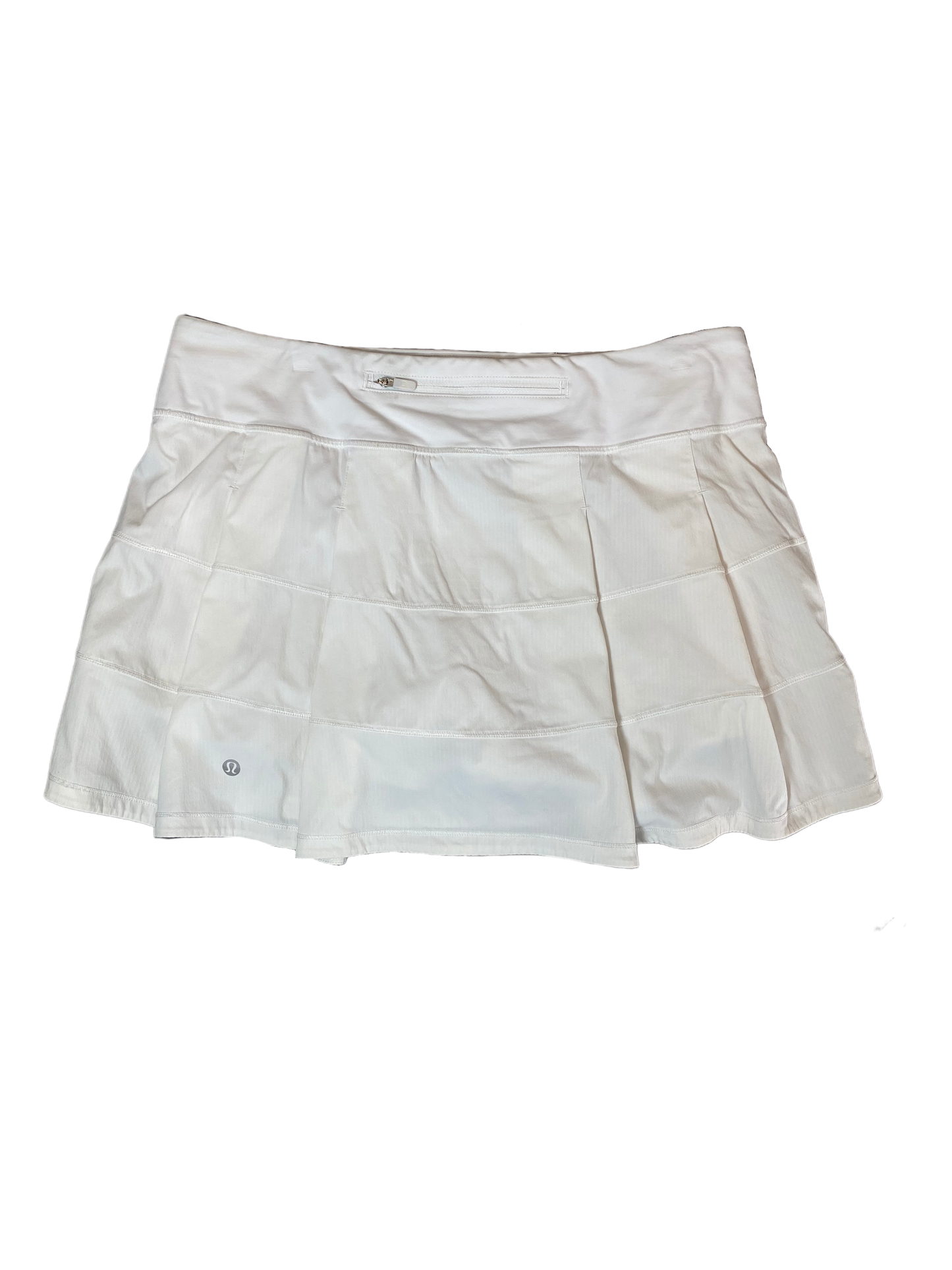 Lululemon White Skort Look stylish and stay organized with this Lululemon white skort! Crafted with pleats and equipped with hidden pockets, this skort has got your back (literally). Get