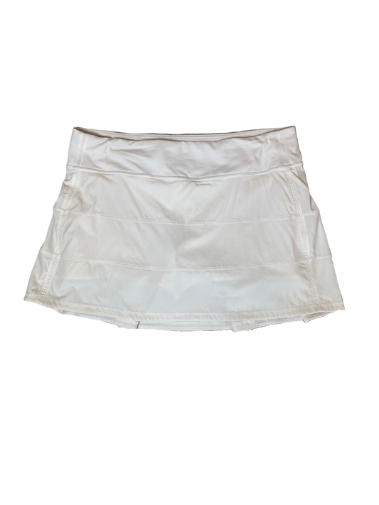 Lululemon White Skort Look stylish and stay organized with this Lululemon white skort! Crafted with pleats and equipped with hidden pockets, this skort has got your back (literally). Get