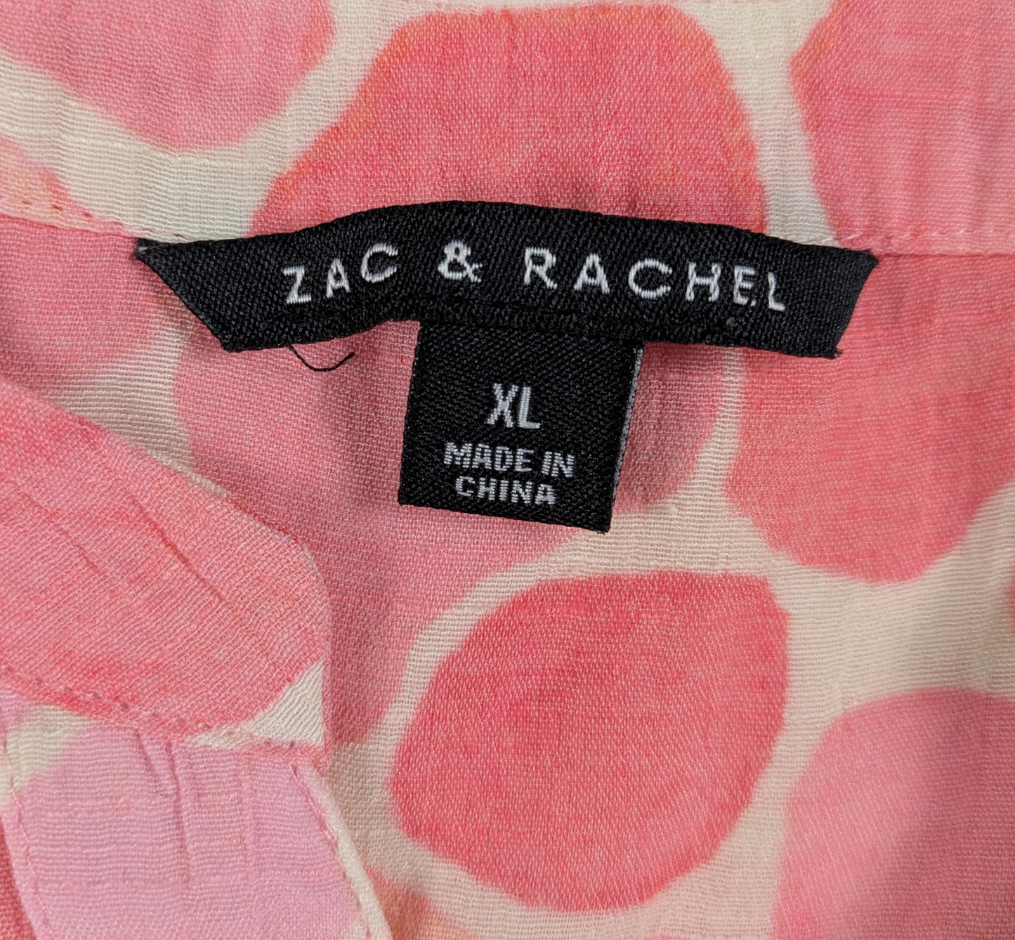 Zac & Rachel Pink Print Long Sleeve Blouse Size XL This Zac & Rachel blouse is a playful addition to your wardrobe. With a V neck, button-up front, and roll tab slee