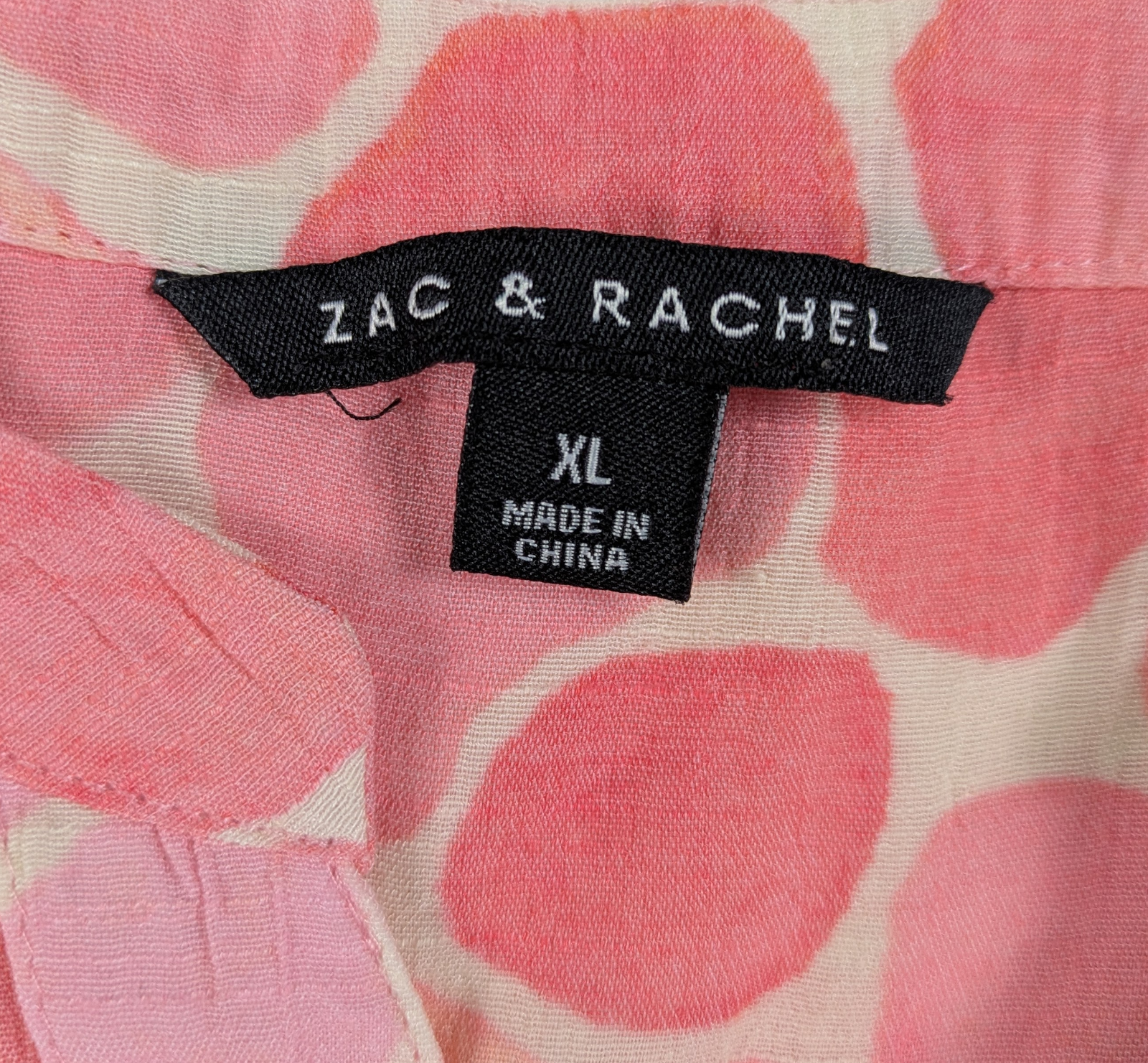 Zac & Rachel Pink Print Long Sleeve Blouse Size XL This Zac & Rachel blouse is a playful addition to your wardrobe. With a V neck, button-up front, and roll tab slee