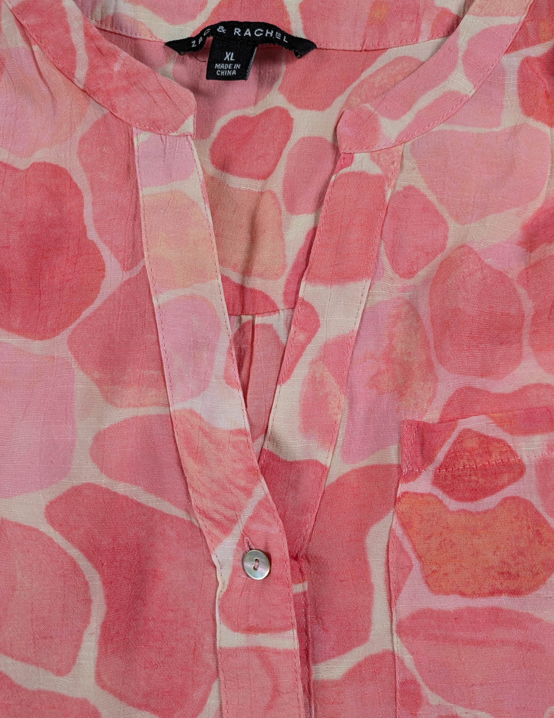 Zac & Rachel Pink Print Long Sleeve Blouse Size XL This Zac & Rachel blouse is a playful addition to your wardrobe. With a V neck, button-up front, and roll tab slee