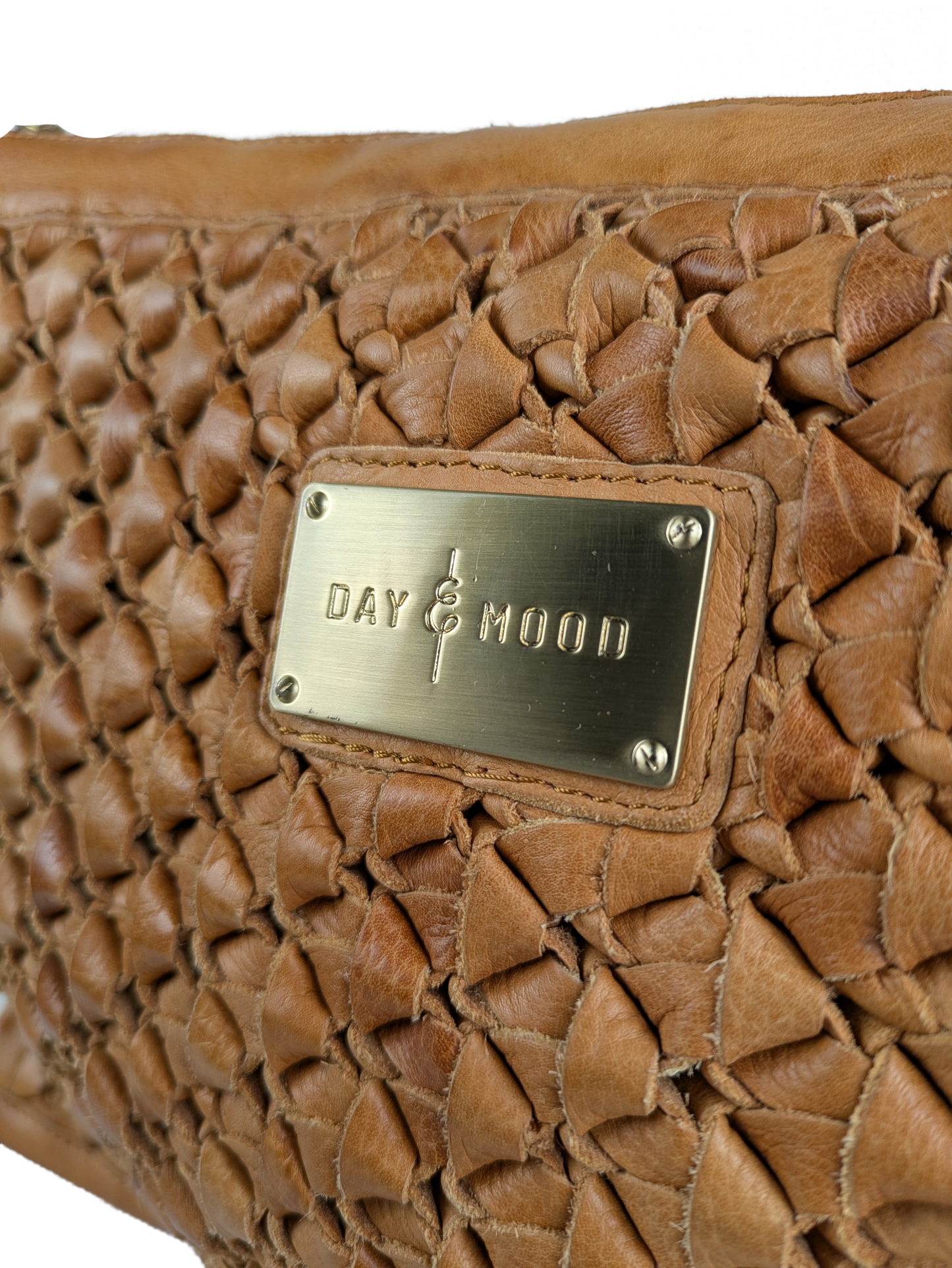 Anthropologie Day & Mood Ann Braided Oversized Clutch Indulge in luxury with the Anthropologie Day &amp; Mood Ann Braided Oversized Clutch. Crafted from soft leather