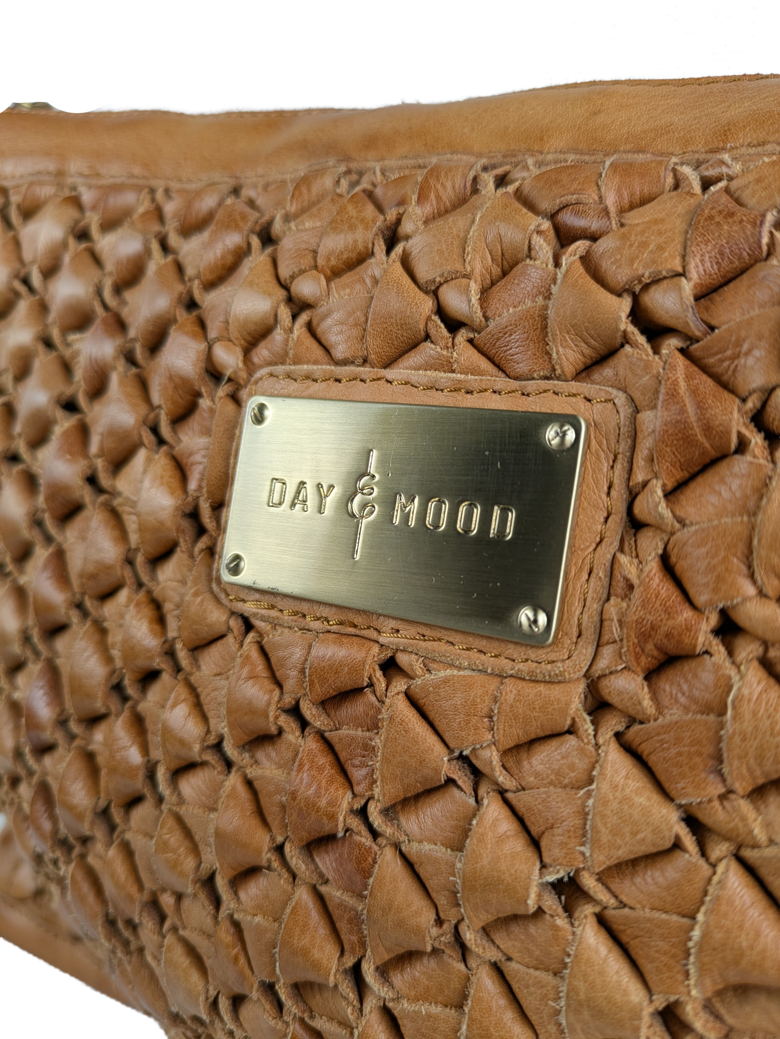 Anthropologie Day & Mood Ann Braided Oversized Clutch Indulge in luxury with the Anthropologie Day &amp; Mood Ann Braided Oversized Clutch. Crafted from soft leather