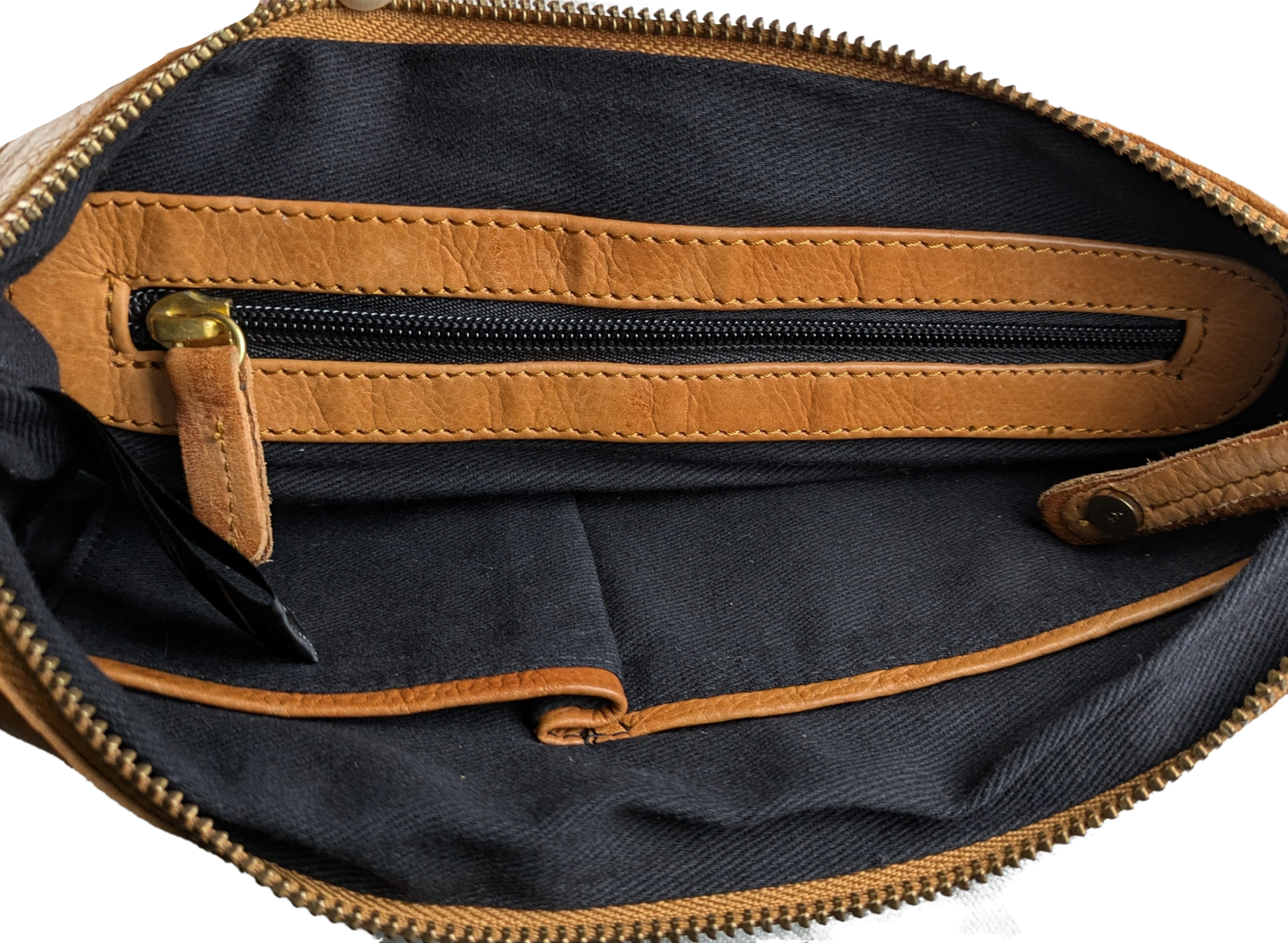Anthropologie Day & Mood Ann Braided Oversized Clutch Indulge in luxury with the Anthropologie Day &amp; Mood Ann Braided Oversized Clutch. Crafted from soft leather