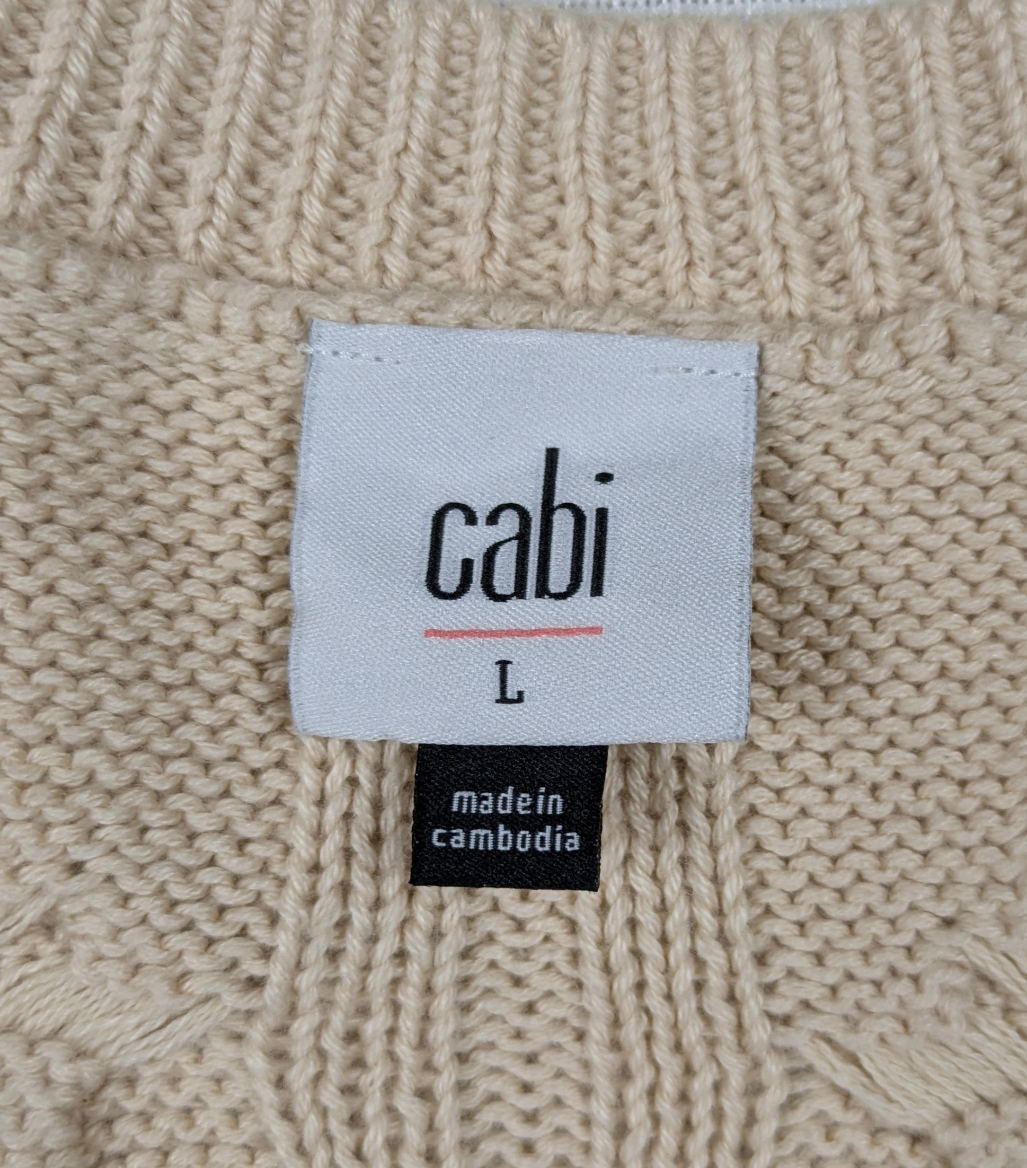 Cabi Long Sleeve Cropped Cable Knit Cream Sweater Size Large Cuddle up in this quirky Cabi cable knit sweater, perfect for chilly days. With its cozy long sleeves, c