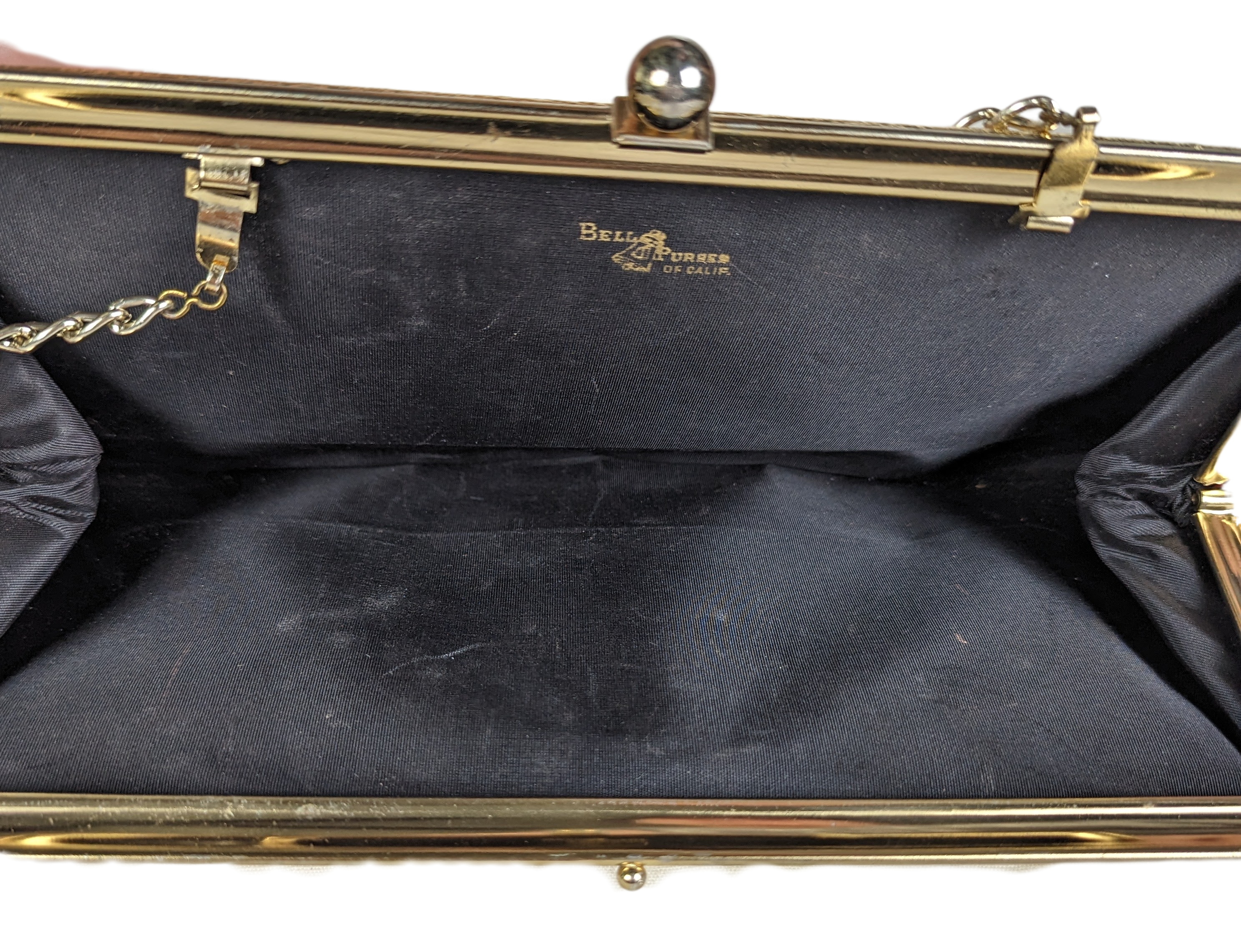 Bell Purses of California Vintage Gold Clutch Perfect little clutch for a night out!Measures:  L - 12"   W - flat  H - 5 1/2"  Strap - 11"HandbagBell Purses of CA Vintage Gold ClutchCA Vintage Gold Clutch