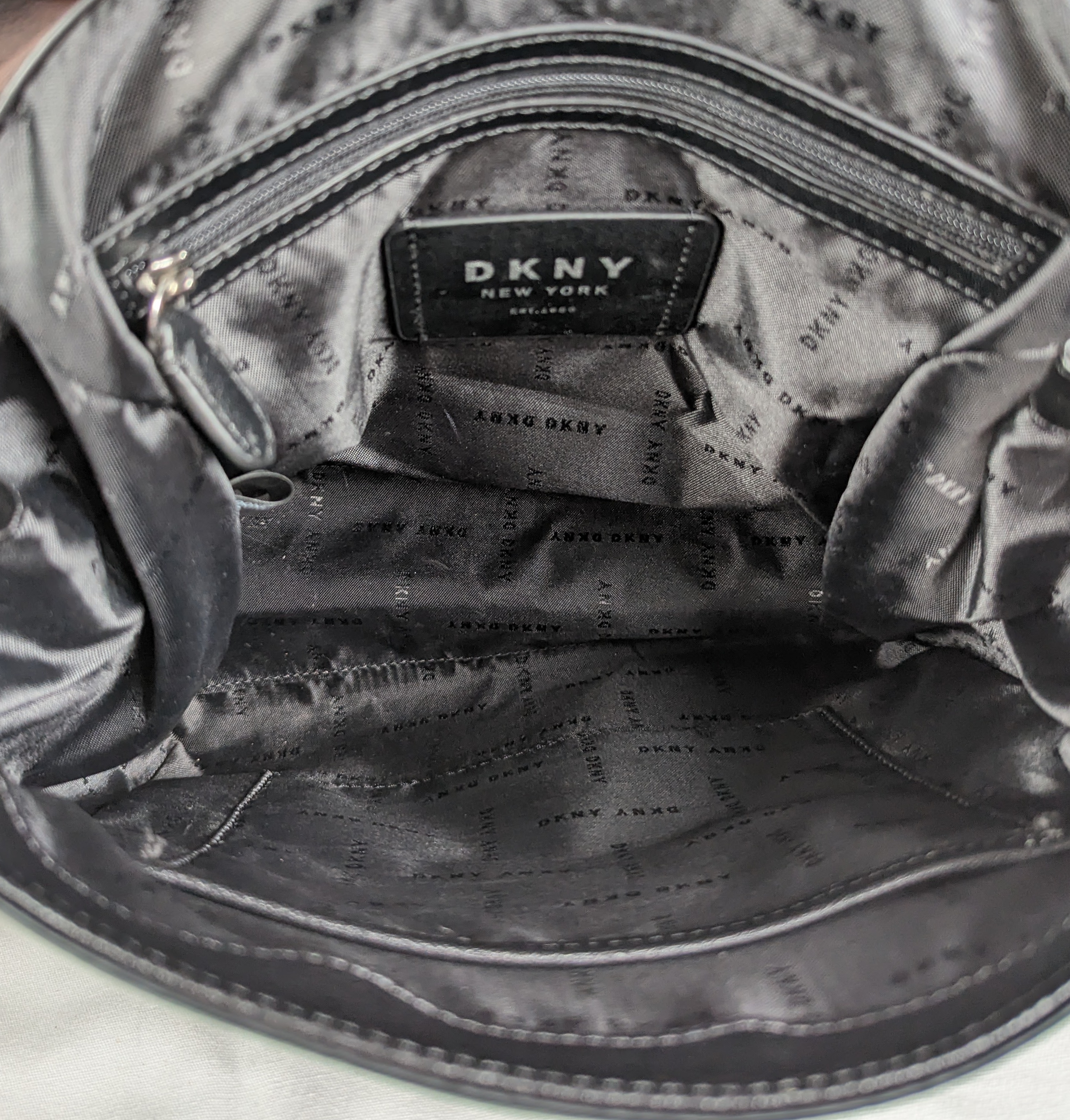 DKNYStylish version of the indispensable backpack, with lots of room for your daily essentials!  In excellent condition!
Measures:  L - 10"  W - 3"  H - 11 1/2"  Strap -HandbagDKNY Black Leather Backpack EUCDKNY Black Leather Backpack EUC