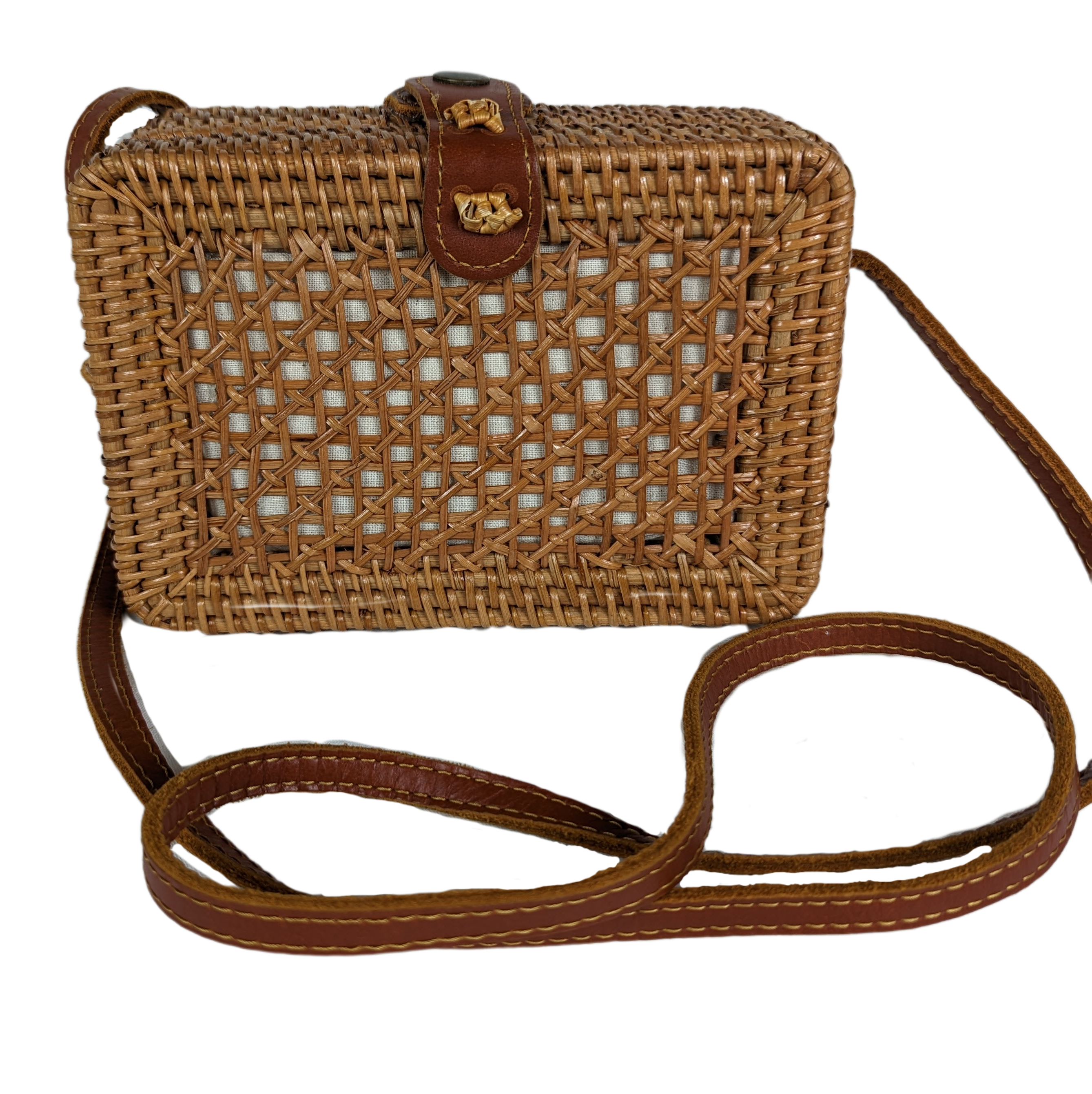  Rectangular Wicker Handbag with Leather Strap and Closure Perfect for summertime, this little purse is ideal for a day shopping or out to brunch.  Measurements:  L - 7 1/2"   W - 3"    H - 5"   Strap - 50"HandbagWicker Rectangular Purse with Leather Strap and ClosureWicker Rectangular Purse