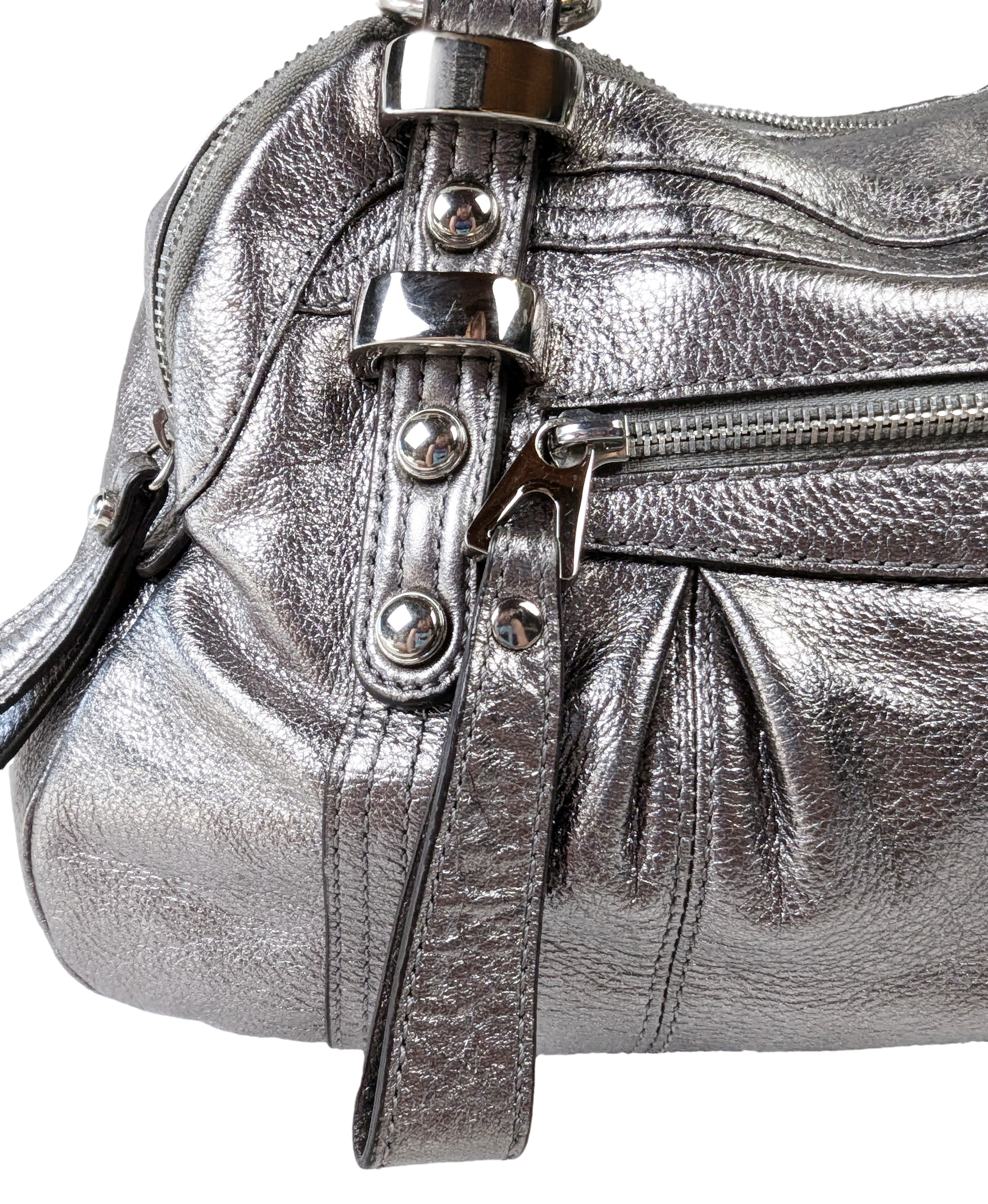 B. Makowsky Silver Leather Handbag with Animal Print Lining Unleash your wild side with the B. Makowsky Silver Leather Handbag! Featuring a playful animal print lini