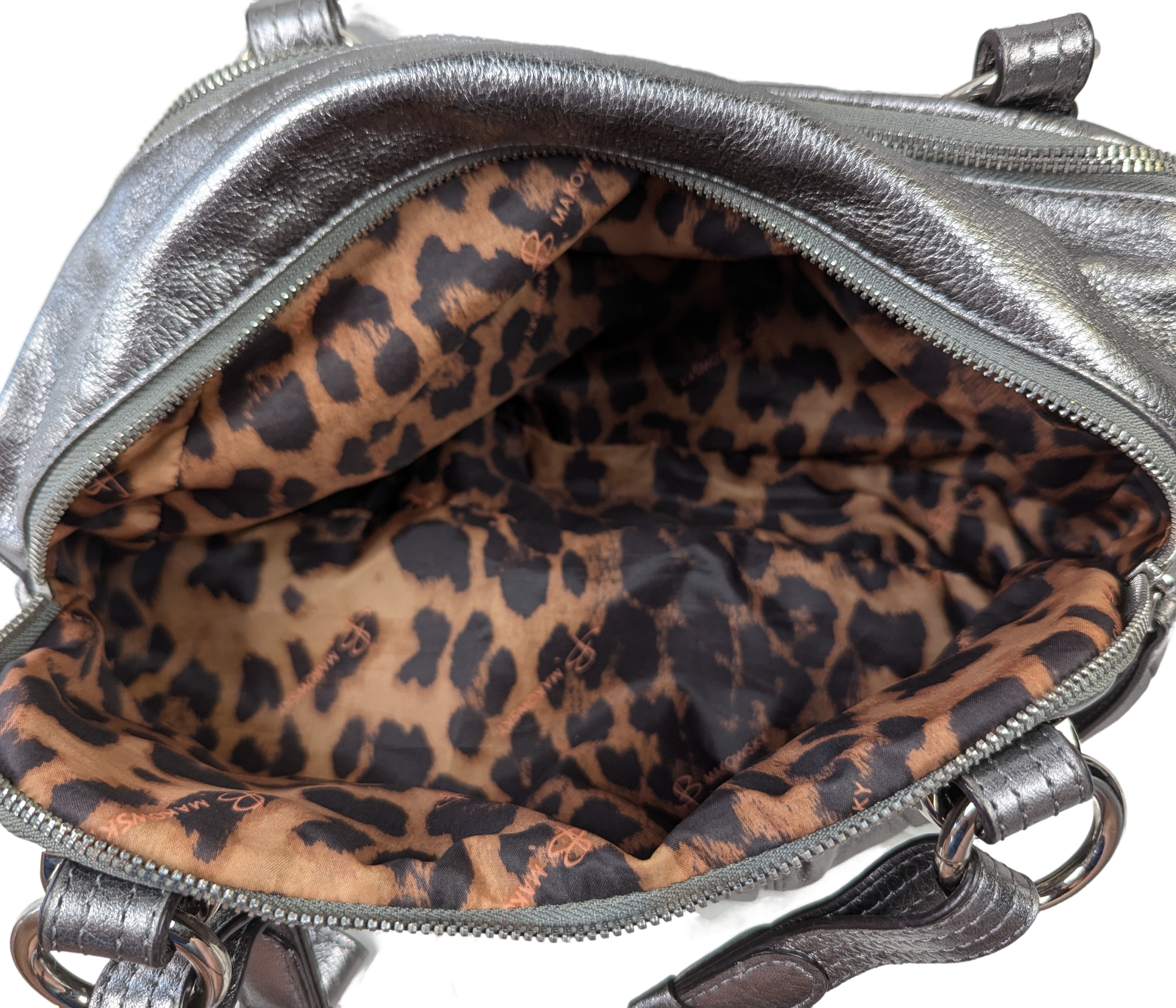 B. Makowsky Silver Leather Handbag with Animal Print Lining Unleash your wild side with the B. Makowsky Silver Leather Handbag! Featuring a playful animal print lini