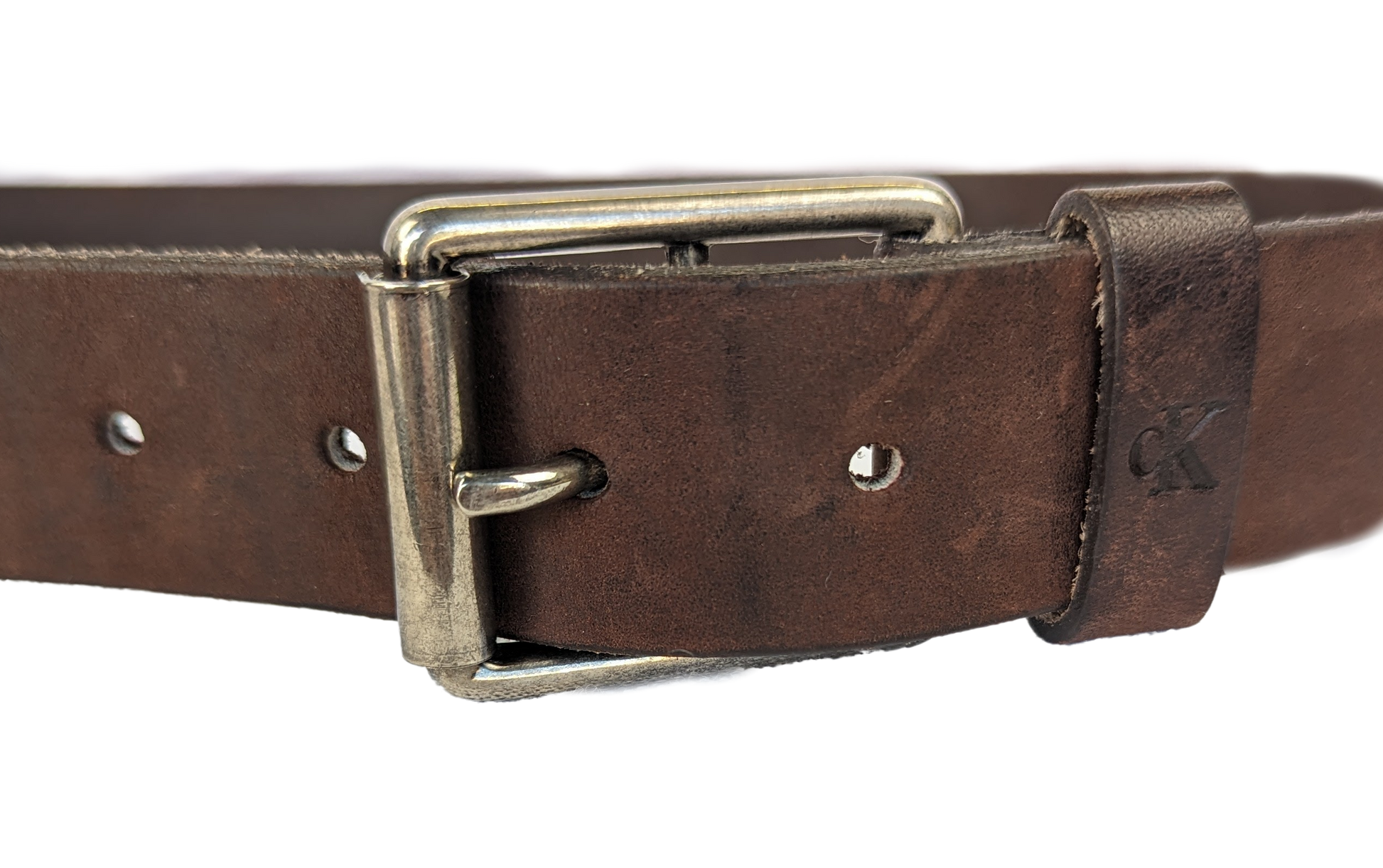 Calvin Klein Brown Leather Belt Calvin Klein brown leather belt will go perfect with your favorite jeans and boots!  The neutral color goes perfect with any outfit.  The silver tone metal is classibeltCalvin Klein Brown Leather BeltCalvin Klein Brown Leather Belt