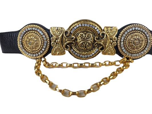 Streets AheadRevitalize your wardrobe with the Vintage Streets Ahead Statement Belt. Made from black leather with gold details and rhinestone accents, this belt adds a touch of gbeltVintage Streets Ahead Statement BeltVintage Streets Ahead Statement Belt