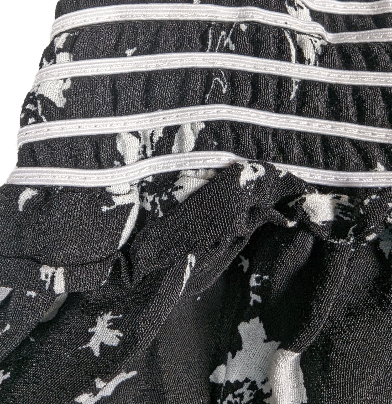 Free People Black and White Smocked Jumpsuit Size XS Go bold and free with the Free People Jumpsuit! This black and white stunner features adjustable shoulder ties a