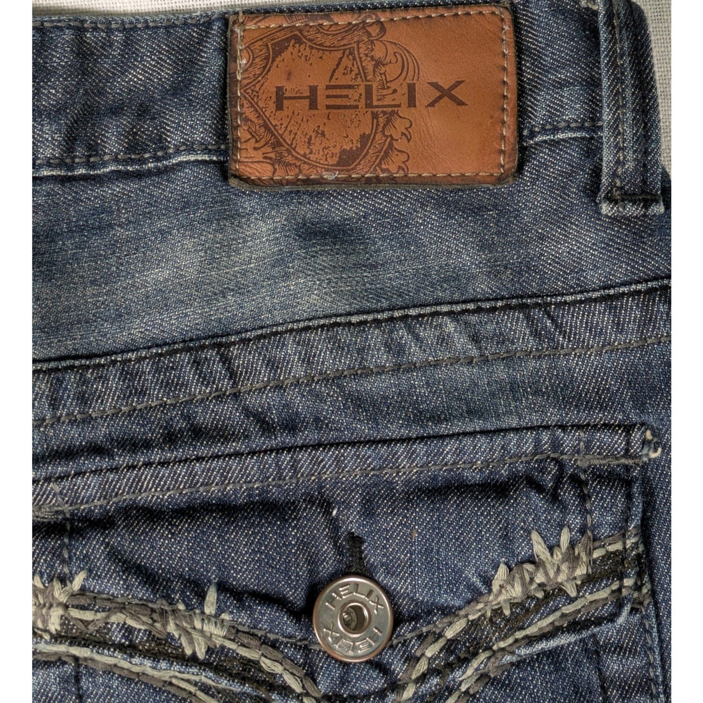 Helix Boot Cut Men's Jeans with Embroidered Pockets Size 34/34 Sustainable fashion isn't about compromise—it's about choosing pieces with soul. This pair carries his