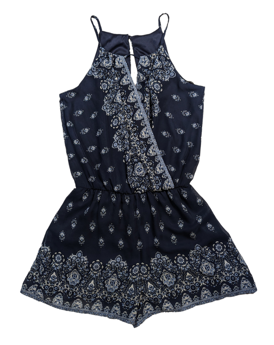 BCX Navy Halter Neck Romper Size XS NWT  Go ahead, BCX your fashion game with this navy halter neck romper. Perfect for any occasion, the stylish print and flatterin