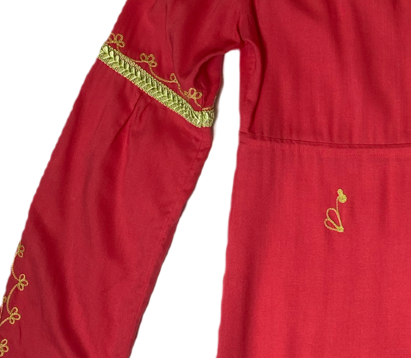 Moda International Embroidered Detail Dress Moda International embroidered detail dress with long sleeves and a ruffle hem. Dress to impress with this Moda Internati