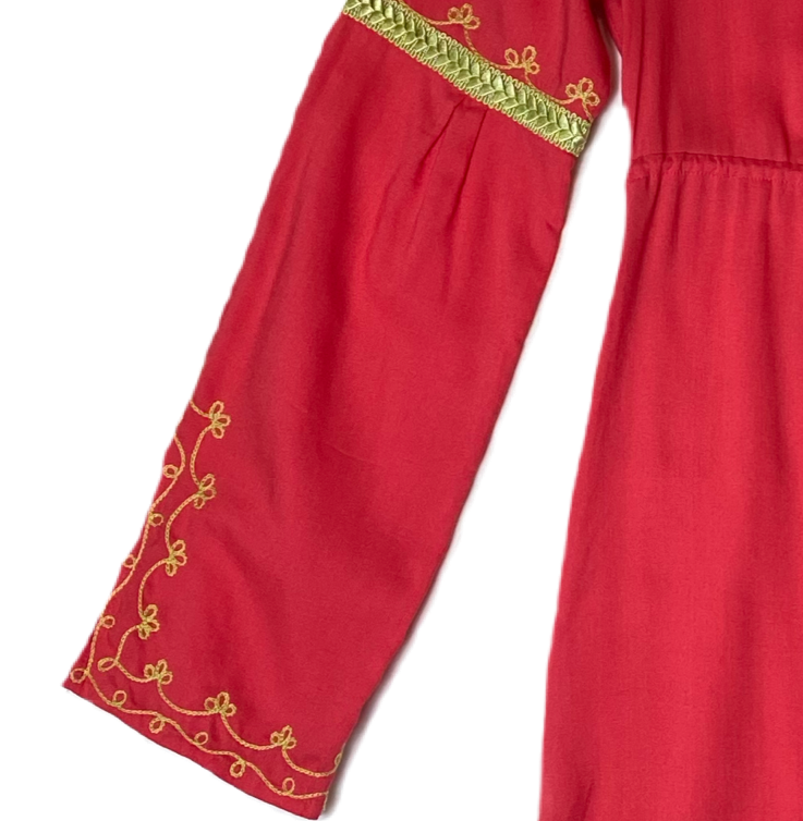 Moda International Embroidered Detail Dress Moda International embroidered detail dress with long sleeves and a ruffle hem. Dress to impress with this Moda Internati