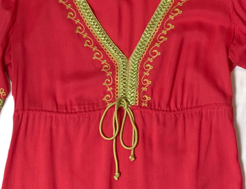 Moda International Embroidered Detail Dress Moda International embroidered detail dress with long sleeves and a ruffle hem. Dress to impress with this Moda Internati