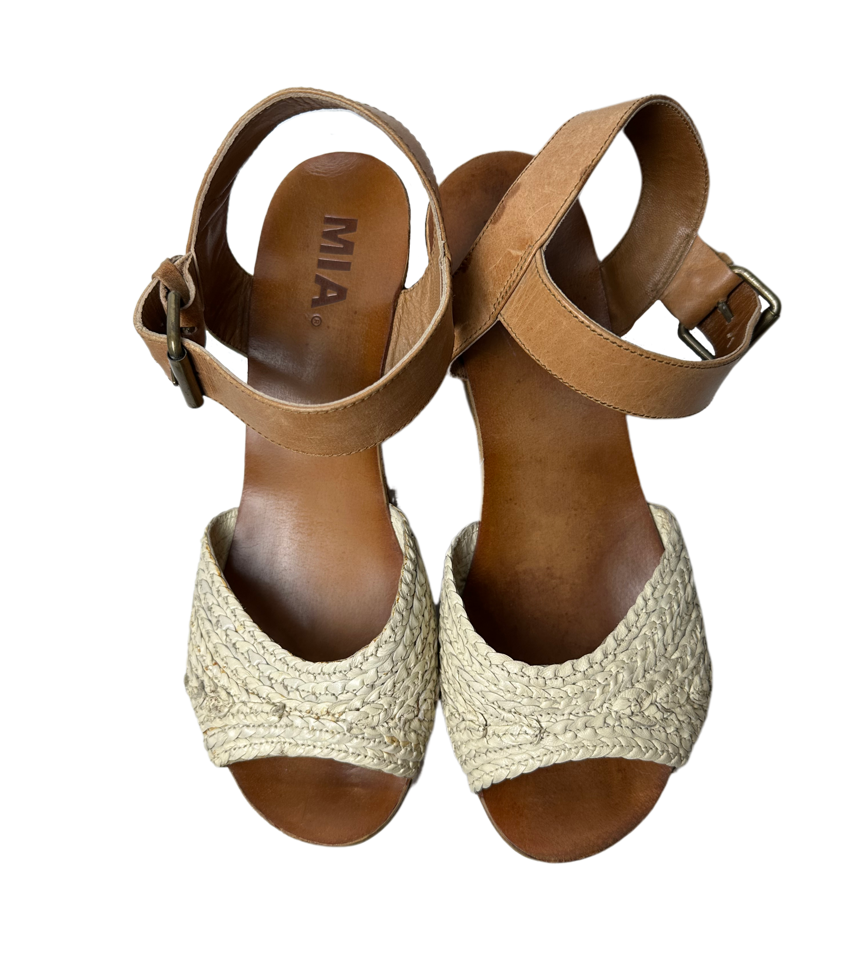 MiaThese Mia platform wood heel shoes boast a stylish look with an off-white crochet-like band and brown leather ankle strap. The wood platform heel adds fashion intereShoesMia Platform Wood Heel Shoes with "Crochet" BandMia Platform Wood Heel Shoes