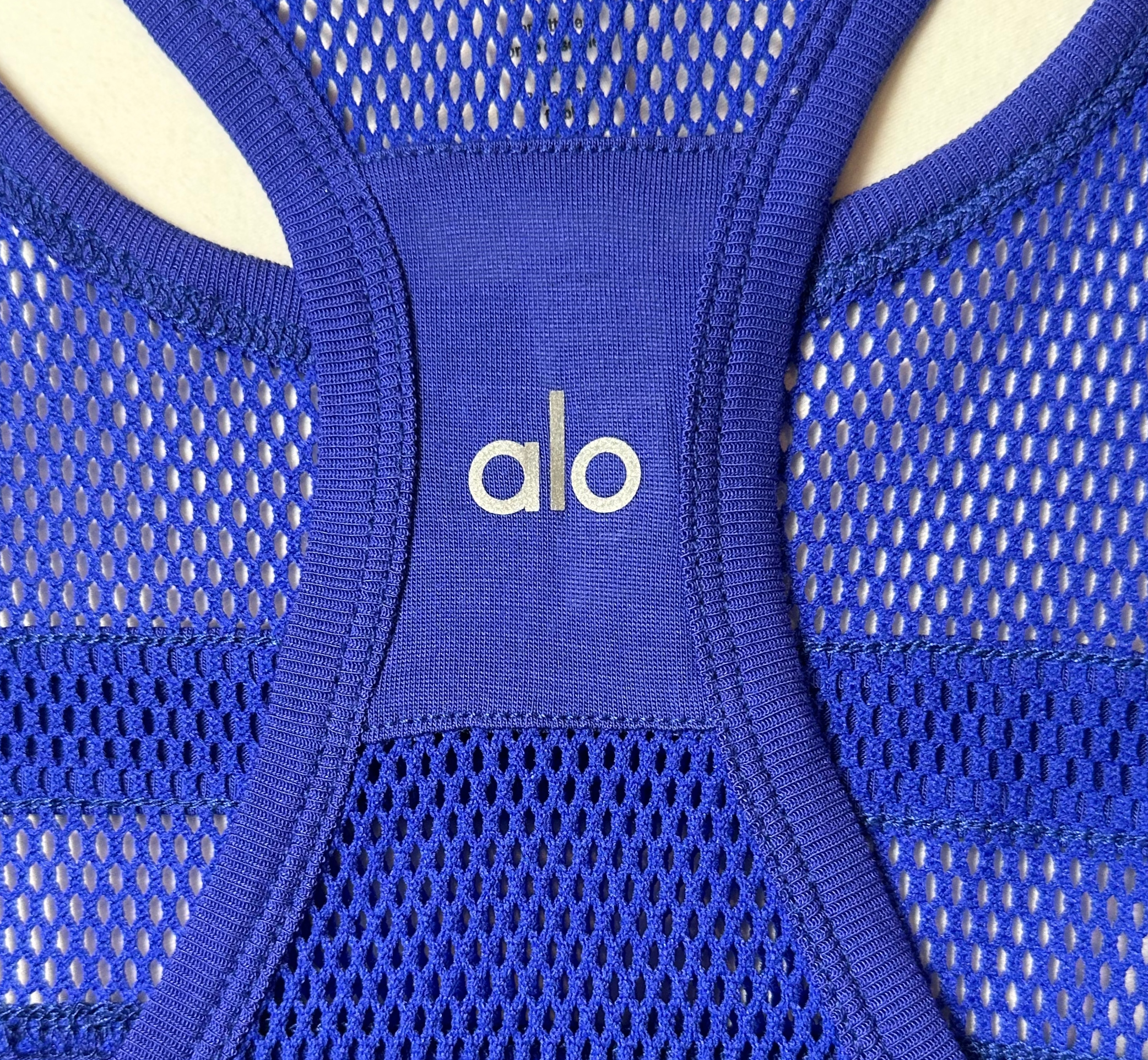 aloThis bright blue new with tags Alo Yoga tank has got it all! Look stylish with the razor back design and mesh details, and feel comfortable with the breathable fabriTank TopAlo Yoga Bright Blue Razor Back Tank with Mesh Details - NWTAlo Yoga Bright Blue Razor Back Tank