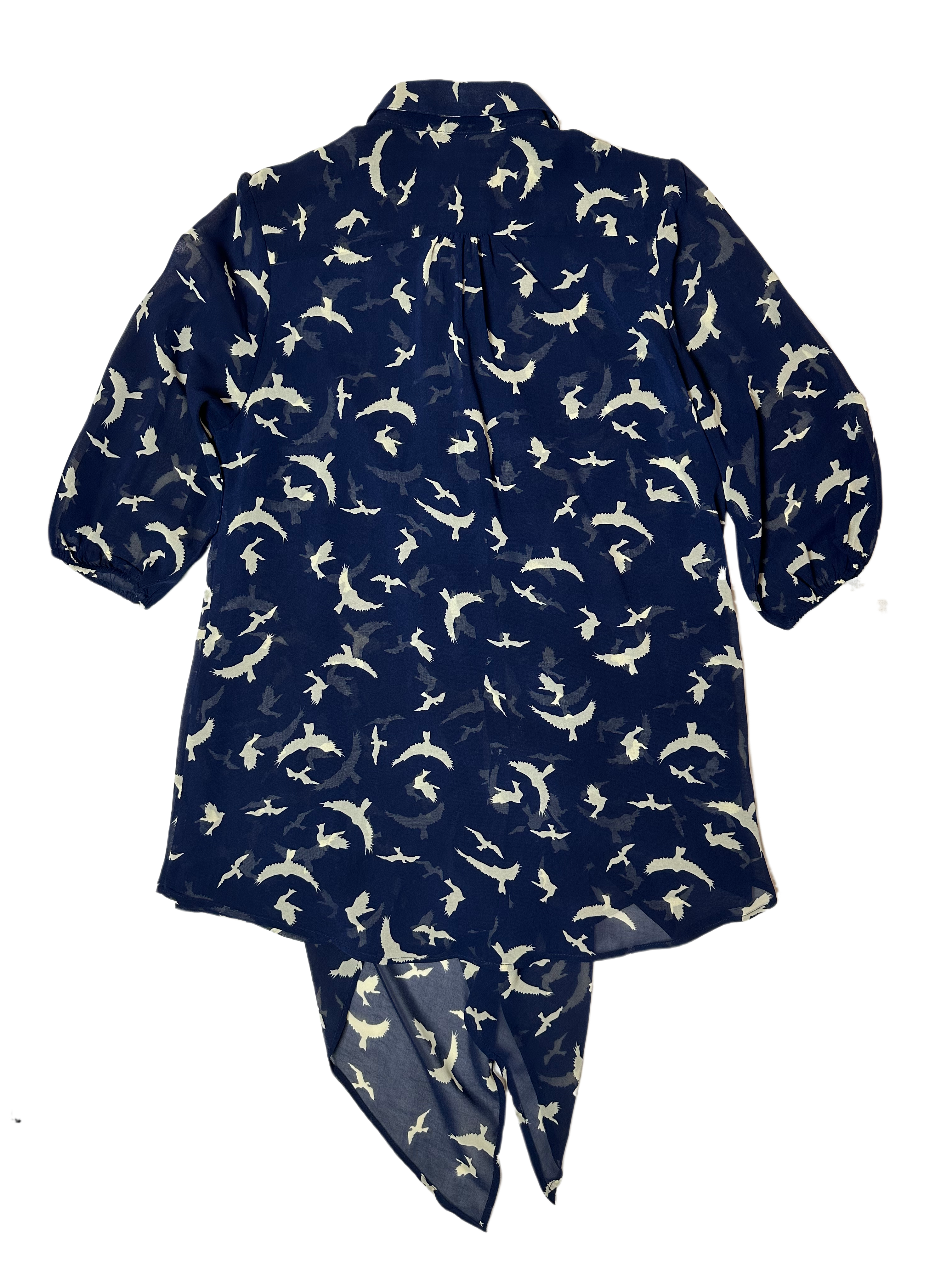 Live a Little Bird Print Blouse with Flowy Front is both stylish and fun. Featuring a unique bird pattern, slightly puffy sleeves, and a flowy front with button closure, this daShirtLive a Little Bird Print Blouse with Flowy FrontBird Print Blouse