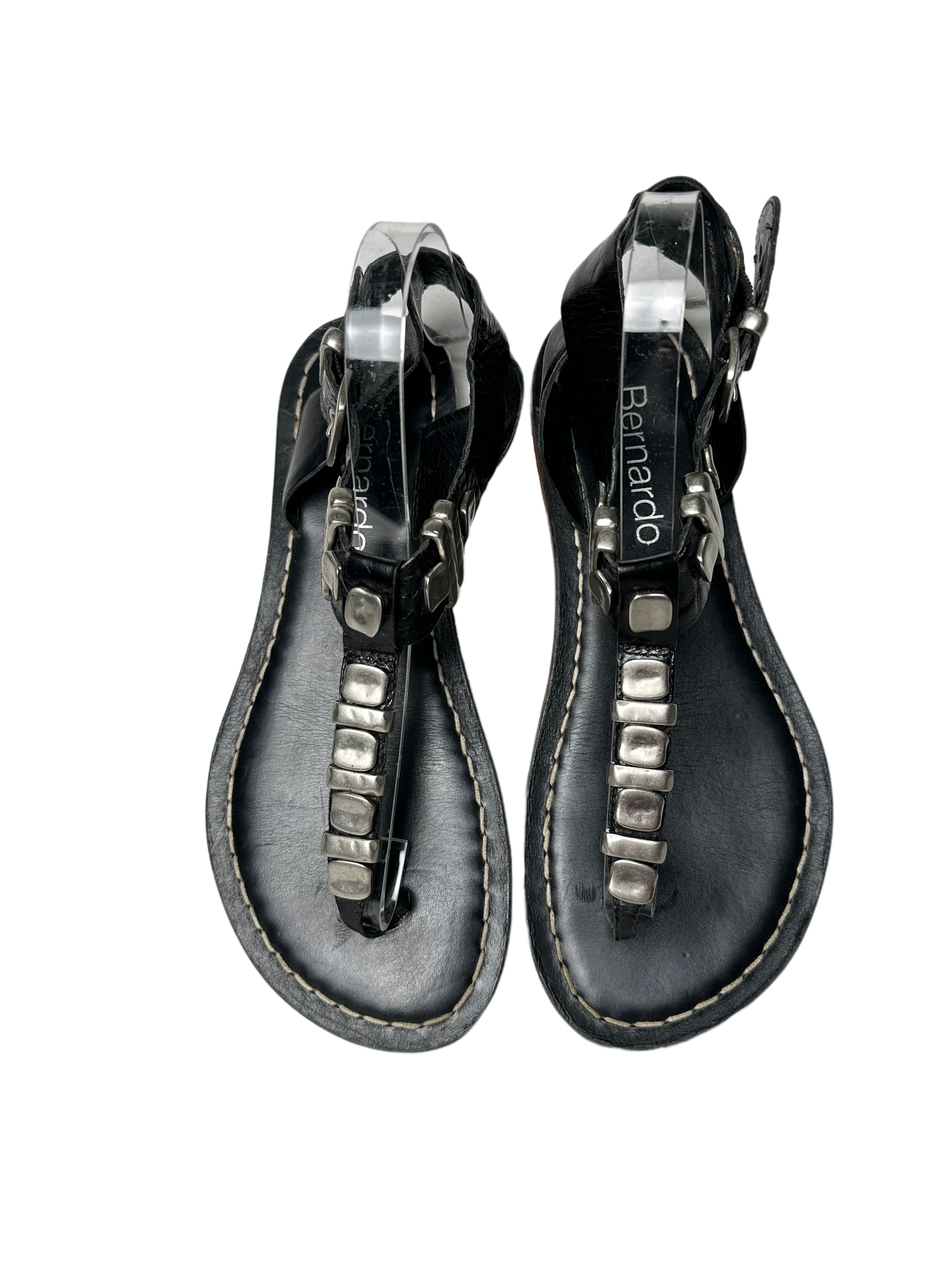 BernardoEmbrace bold style with the Bernardo Milan sandal! Crafted from smooth leather and featuring chunky silver metal accents, these T-strap sandals will inspire your advShoesBernardo Milan Flat T-strap Black Leather Sandal-strap Black Leather Sandal