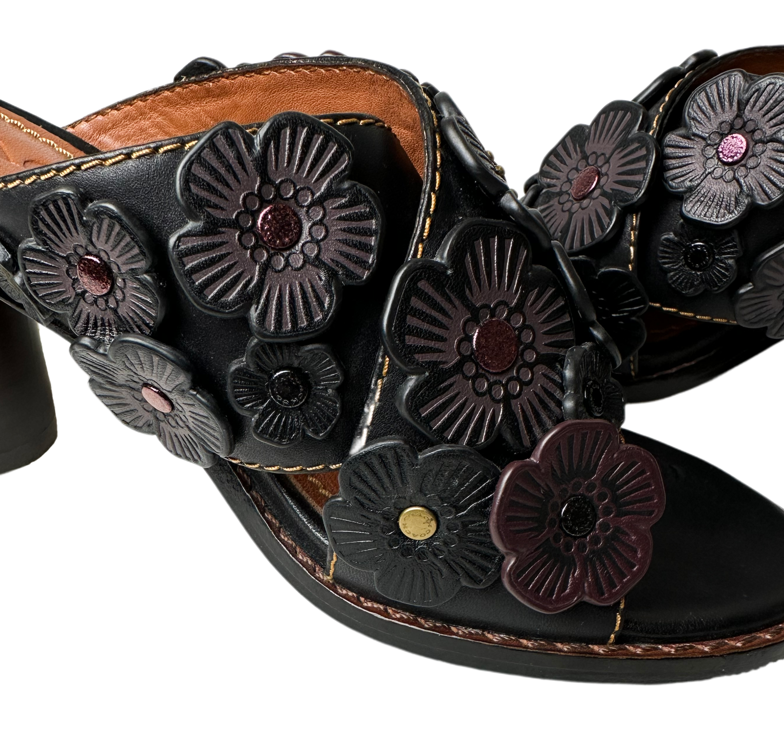 CoachThese brown leather mules from Coach are the perfect way to show off your style. The beautiful flower appliques are the perfect finishing touch, adding just a hint oShoesCoach Brown Leather Tea Rose Mule SandalsCoach Brown Leather Tea Rose Mule Sandals