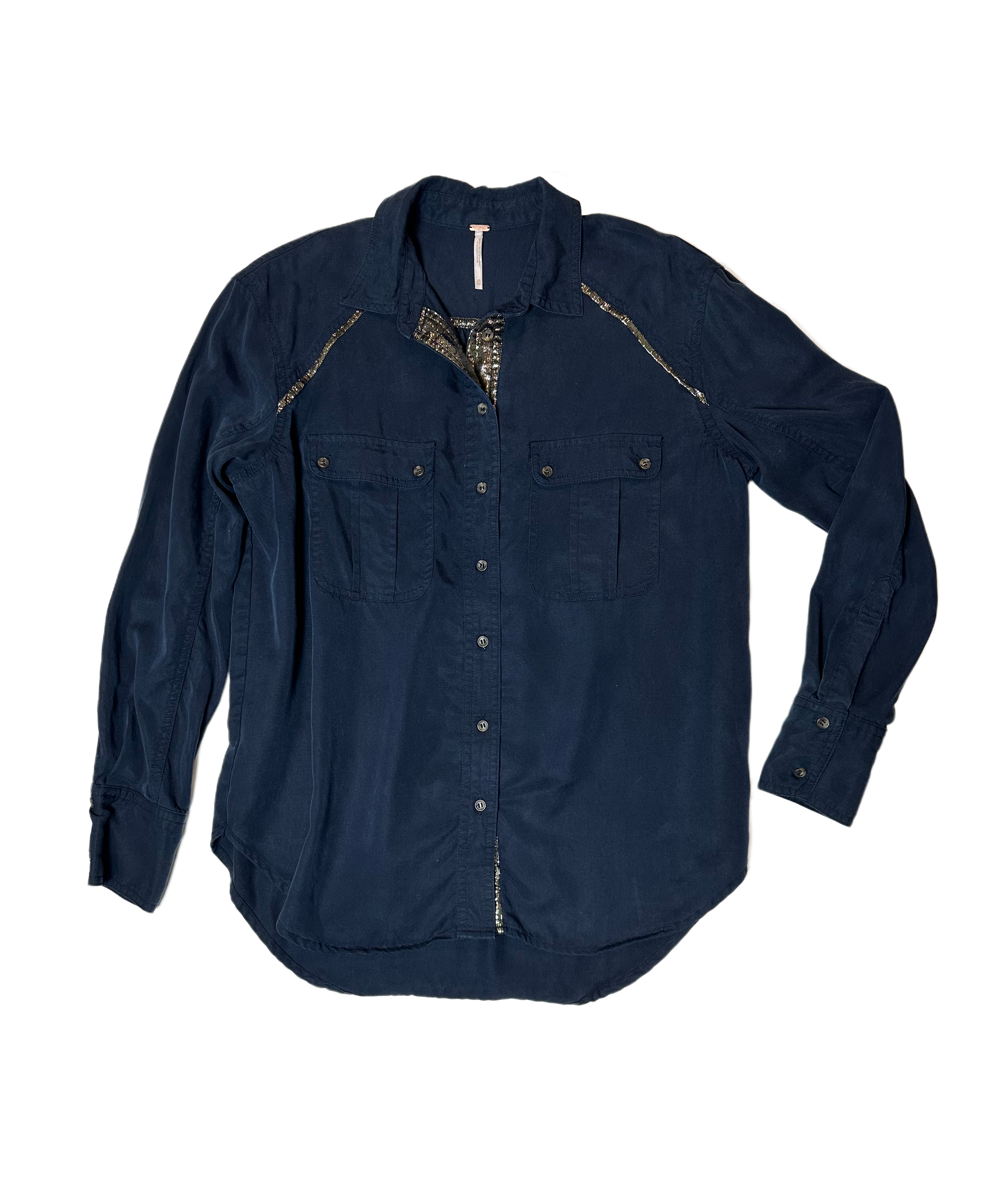 Free PeopleThis Free People midnight blue blouse is the perfect choice for an evening look with a twist! The tencel fabric is soft and light, while the shimmer trim provides a ShirtFree People Midnight Blue Button Front Blouse with Shimmer TrimFree People Midnight Blue Button Front Blouse
