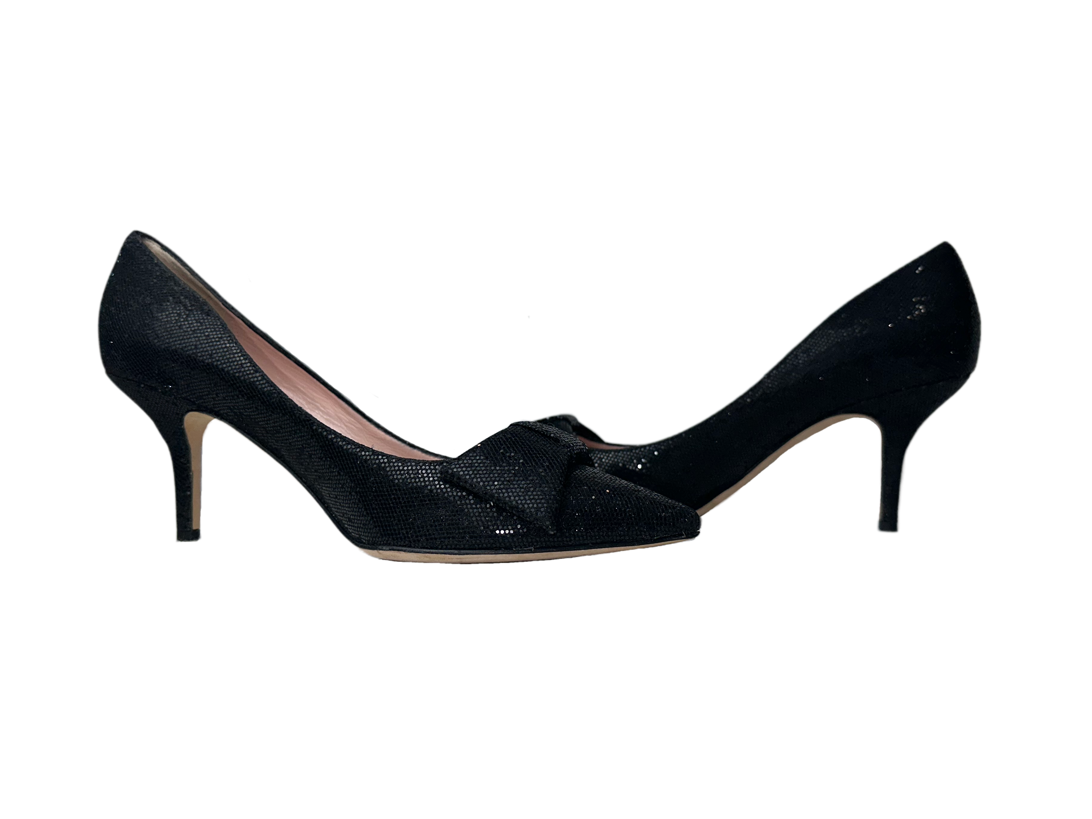 Kate SpadeWalk into any room with confidence wearing these Kate Spade black glitter heels. With a timeless black and glitter design, these heels will make you shine. FeaturingShoesKate Spade Black Glitter Bow HeelsKate Spade Black Glitter Bow Heels