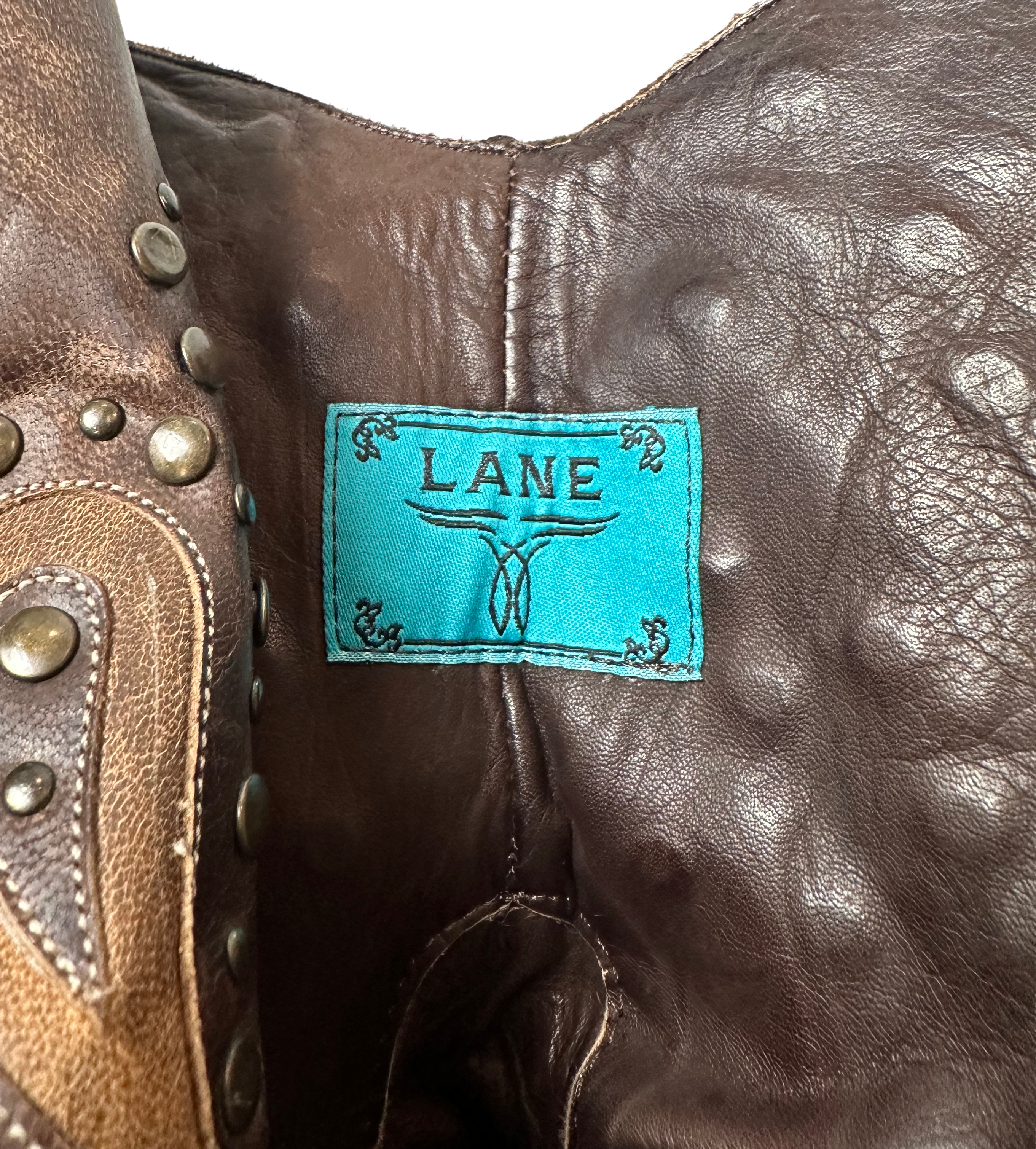 Lane Boots Brown with Cut-Outs, Studs and Side Zips Cowboy Cowgirl Slip into these Lane Boots with ease thanks to the convenient side zips, while the round toe and l