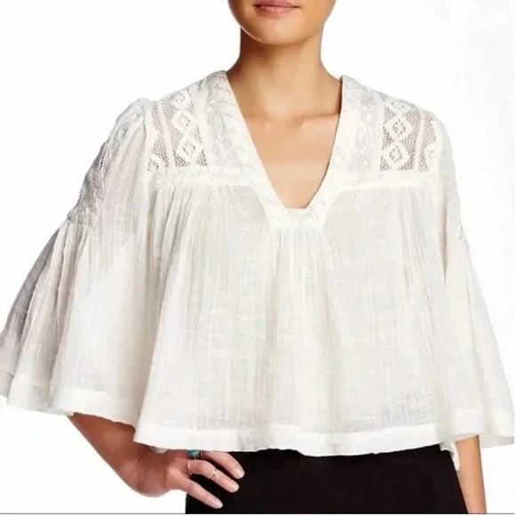 Free People Carry Me Away Crop Top Size XS Get lost in the free-spirited charm of the Free People Carry Me Away Crop Top. Crafted with delicate crochet lace and embr