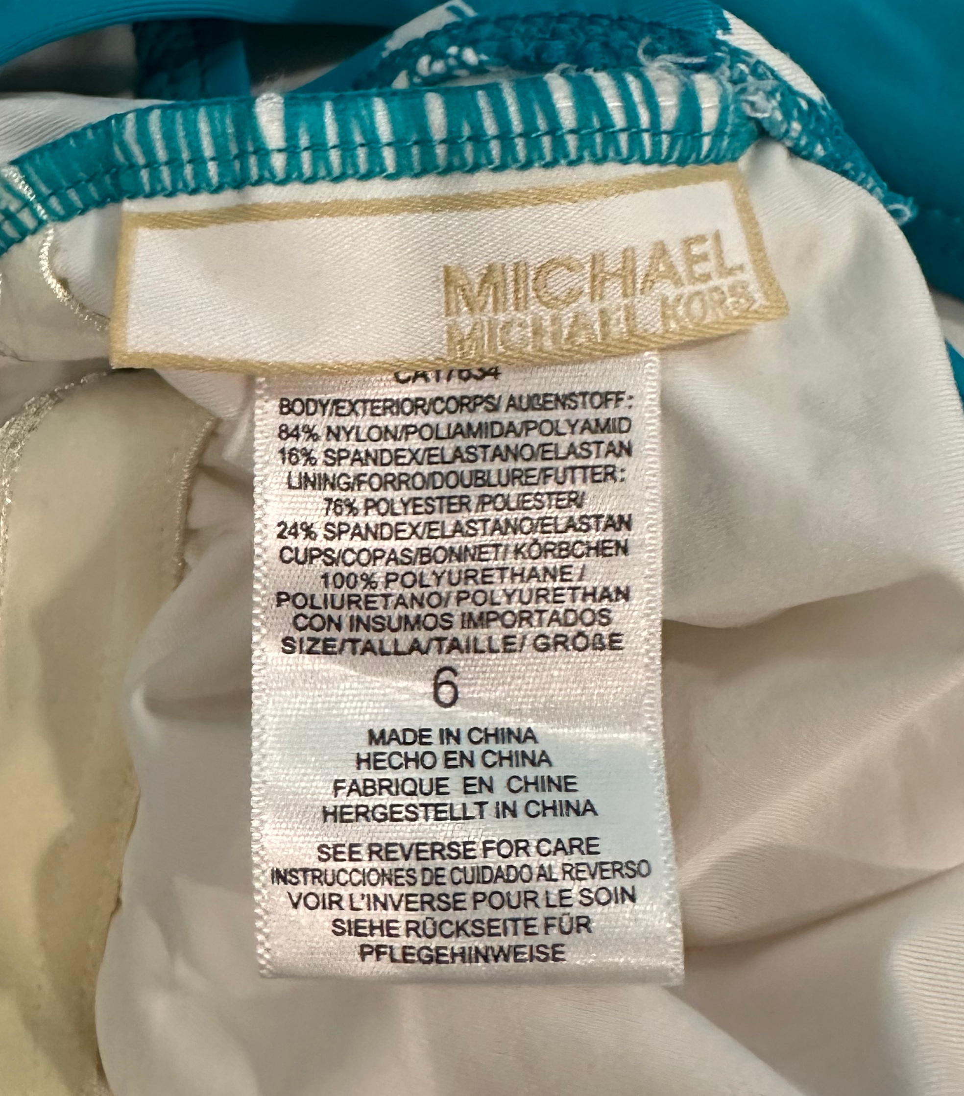 Michael Michael Kors Logo Bar High Neck One Piece Swim Suit size 6 This sassy one piece swim suit features a hard to find trendy turquoise and white print and a gold