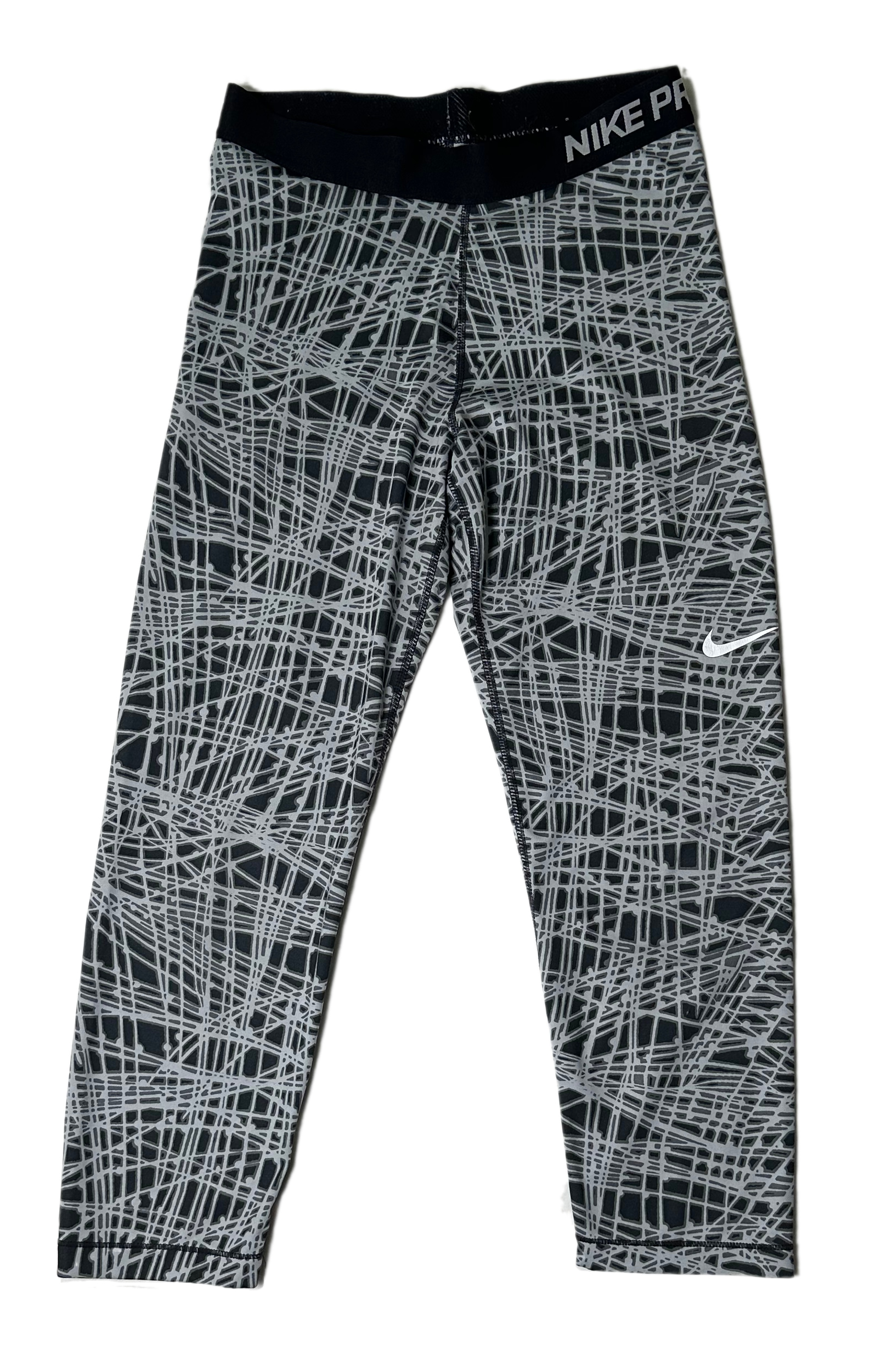 NikeStep up your game in these Nike Pro cropped leggings! Show off the cool and crazy graphic print in black and grey, while staying comfortable with their incredibly soLeggingsNike Pro Black and Grey Print Cropped LeggingsGrey Print Cropped Leggings