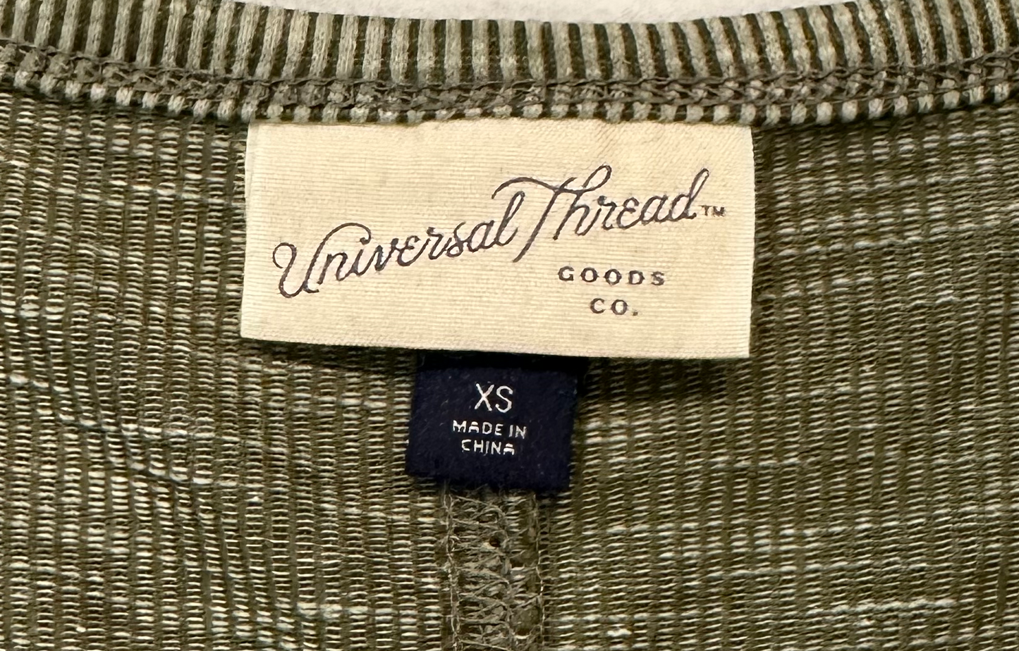 Universal ThreadsThis long-sleeve henley thermal from Universal Threads will keep you feeling cozy and looking cool! Crafted with a soft, moss-green fabric and classic henley style, TopUniversal Threads Moss Green Long Sleeve Henley ThermalUniversal Threads Moss Green Long Sleeve Henley Thermal