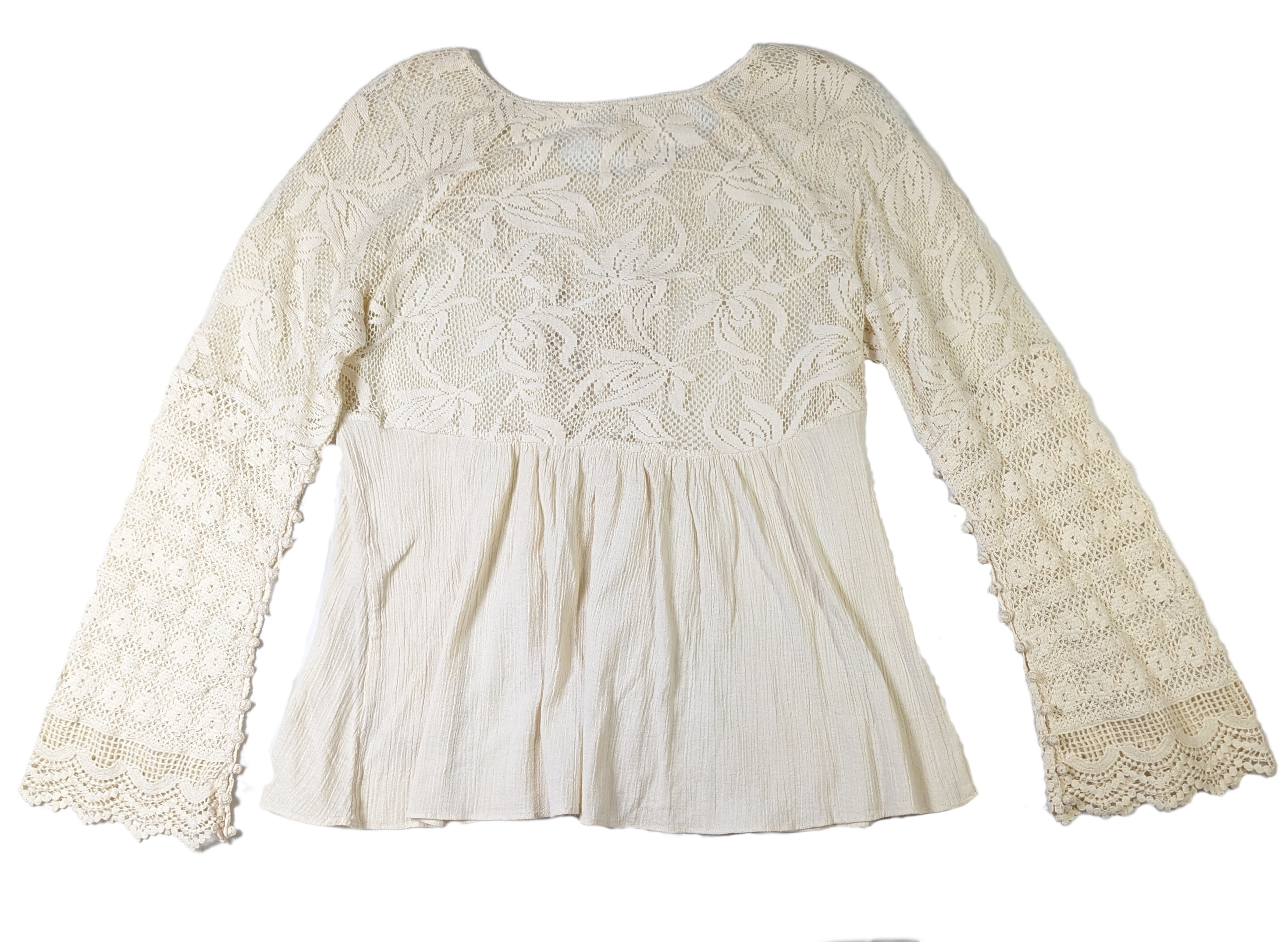 Free People Lace and Crochet TopThis Free People top is a beautiful combination of lace and crochet detail, creating a one-of-a-kind boho look. Crafted with 100% Cotton, the ruffle detail and croch