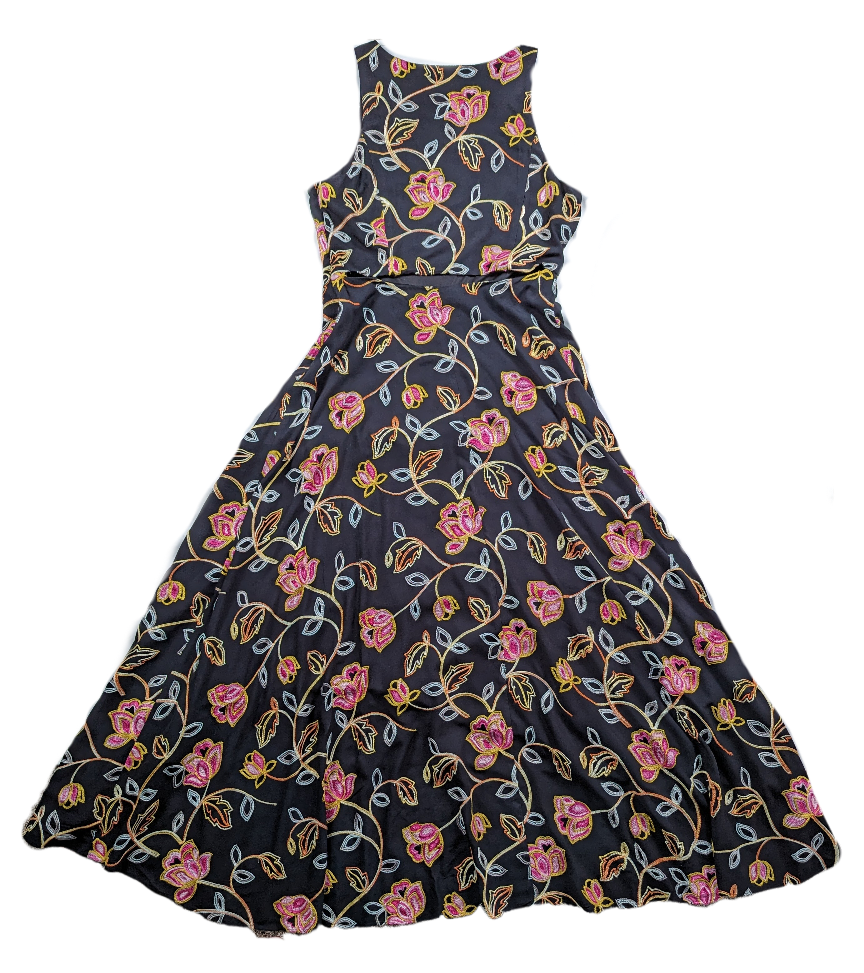 Nicole Miller Black Embroidered High-Low DressLovely embroidered dress from Nicole Miller features a high-low hemline, side-zip and a cut-out back.  Colorful floral embroidery is set against a black background tNicole Miller Black Embroidered High-Low DressDresses